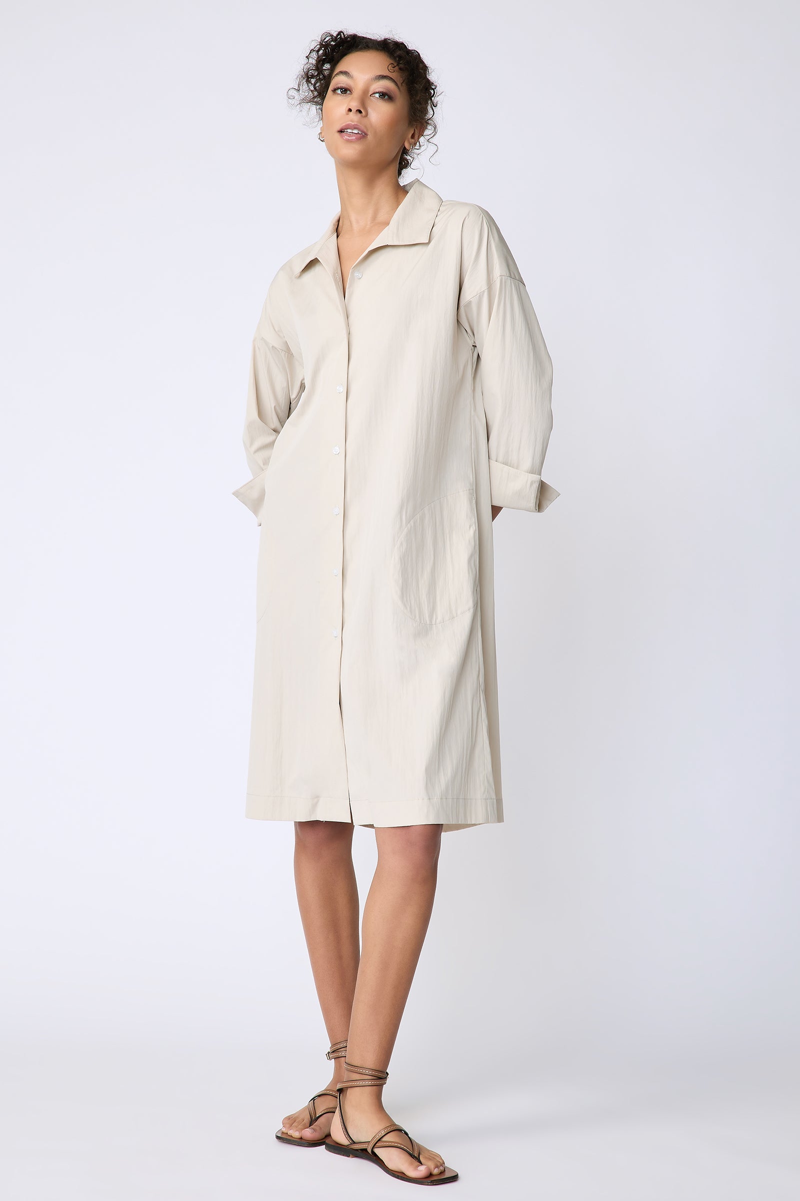 Kal Rieman Marion Shirt Dress in Typewriter cloth khaki on model front view hands behind back