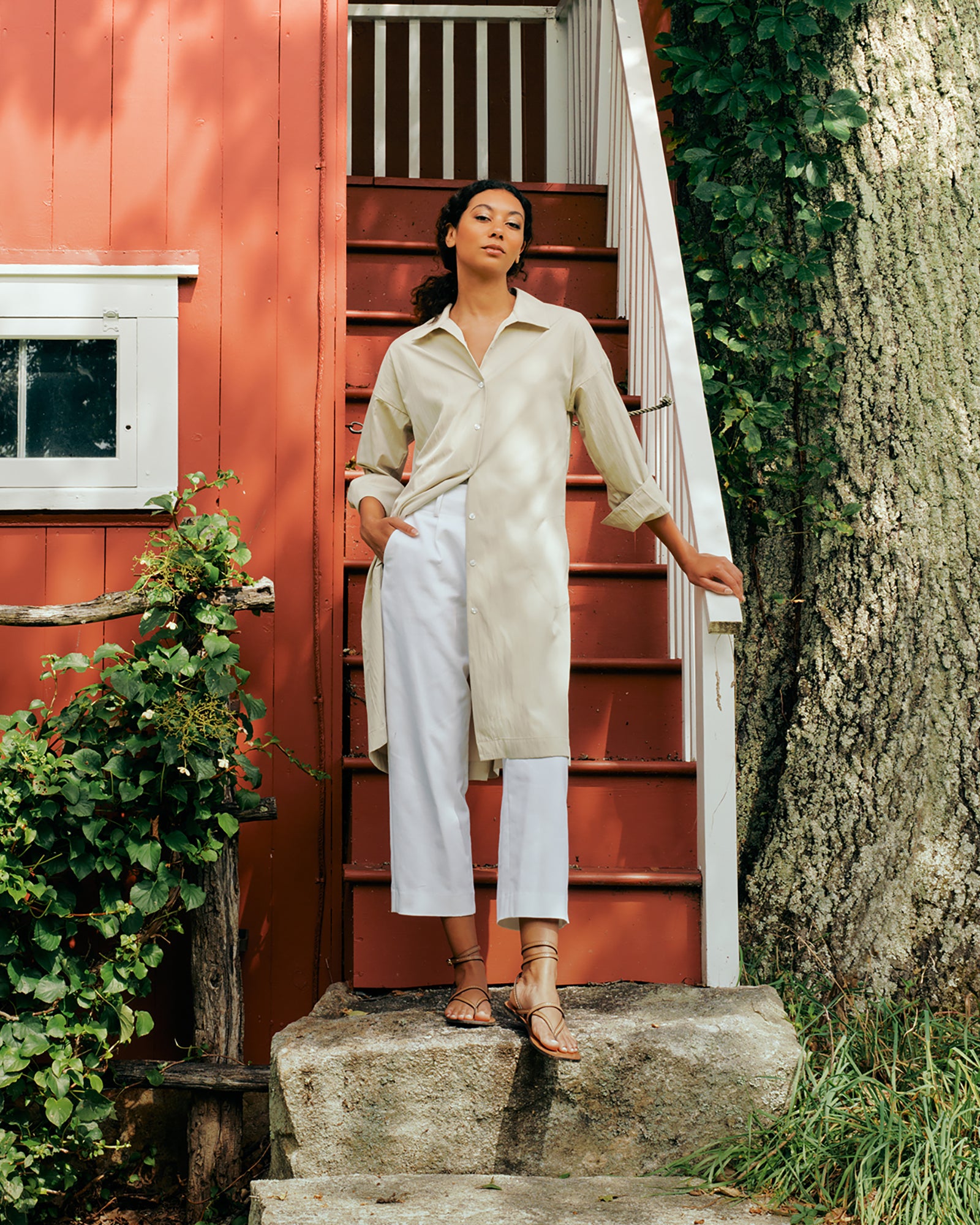 Kal Rieman Marion Shirt Dress in Typewriter cloth khaki on model front view hands behind back