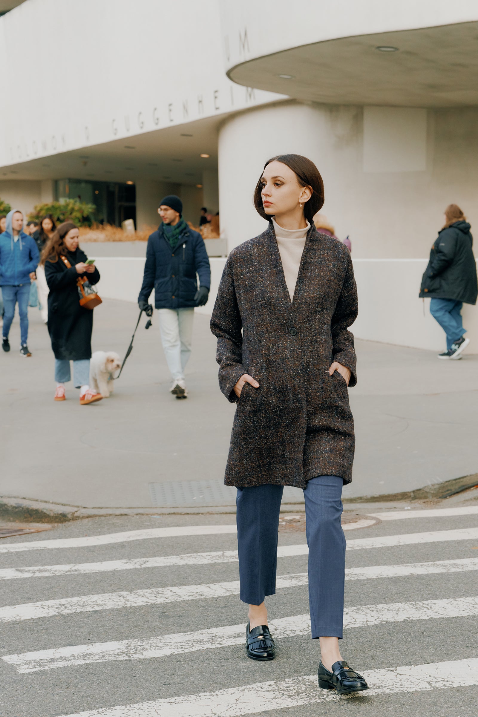 Kal Rieman Martine Trouser in Italian denim suiting on model front view hand in pocket holding collar