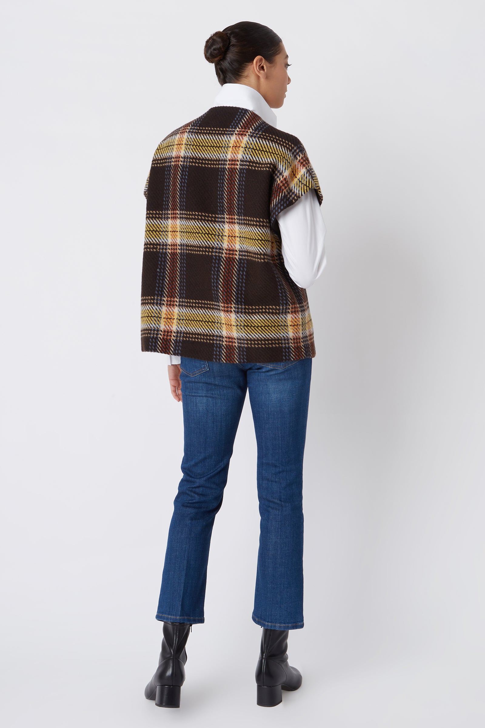 Kal Rieman Mina Zip Vest in Bold Plaid on Model Touching Collar Cropped Front View