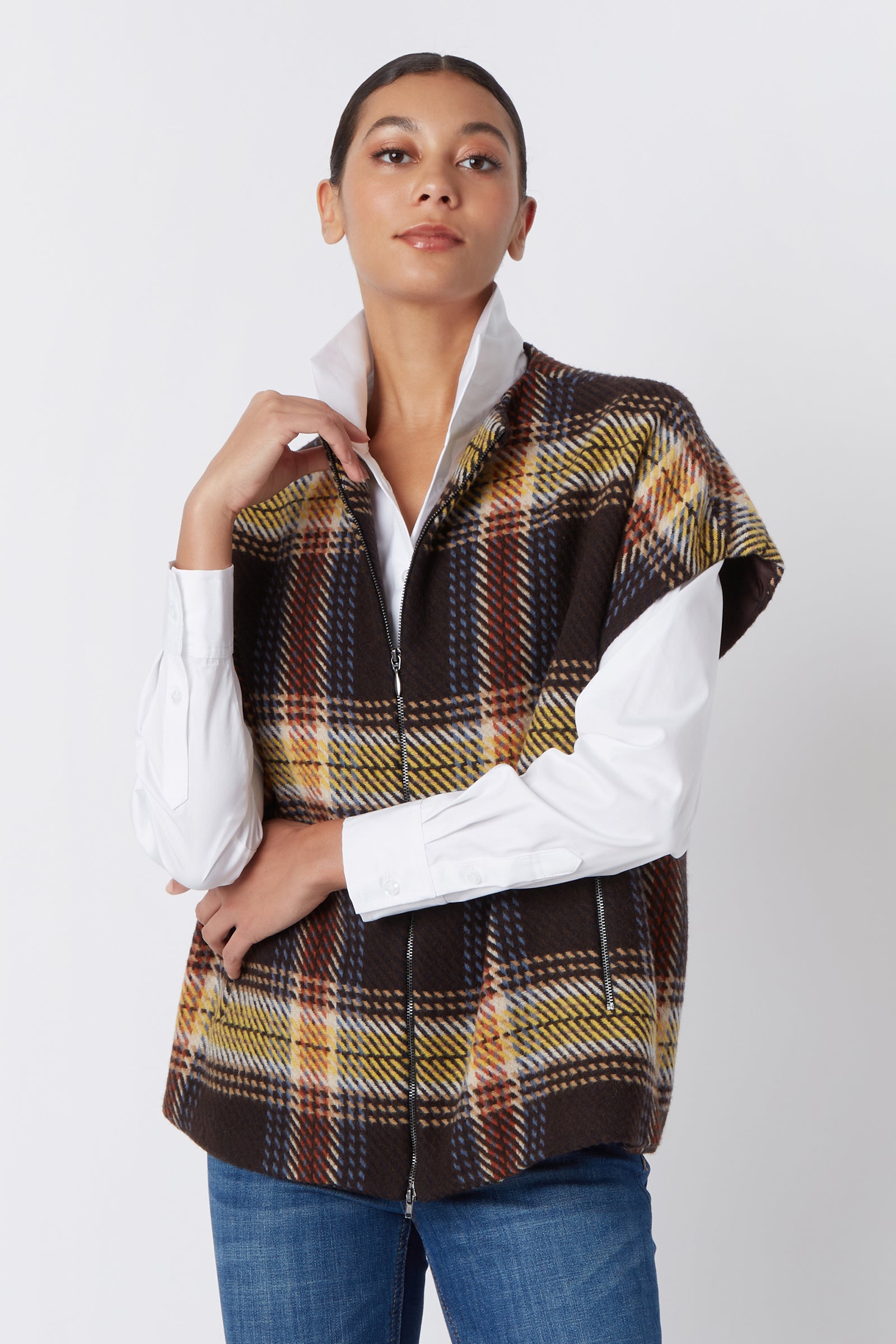 Kal Rieman Mina Zip Vest in Bold Plaid on Model Touching Collar Cropped Front View