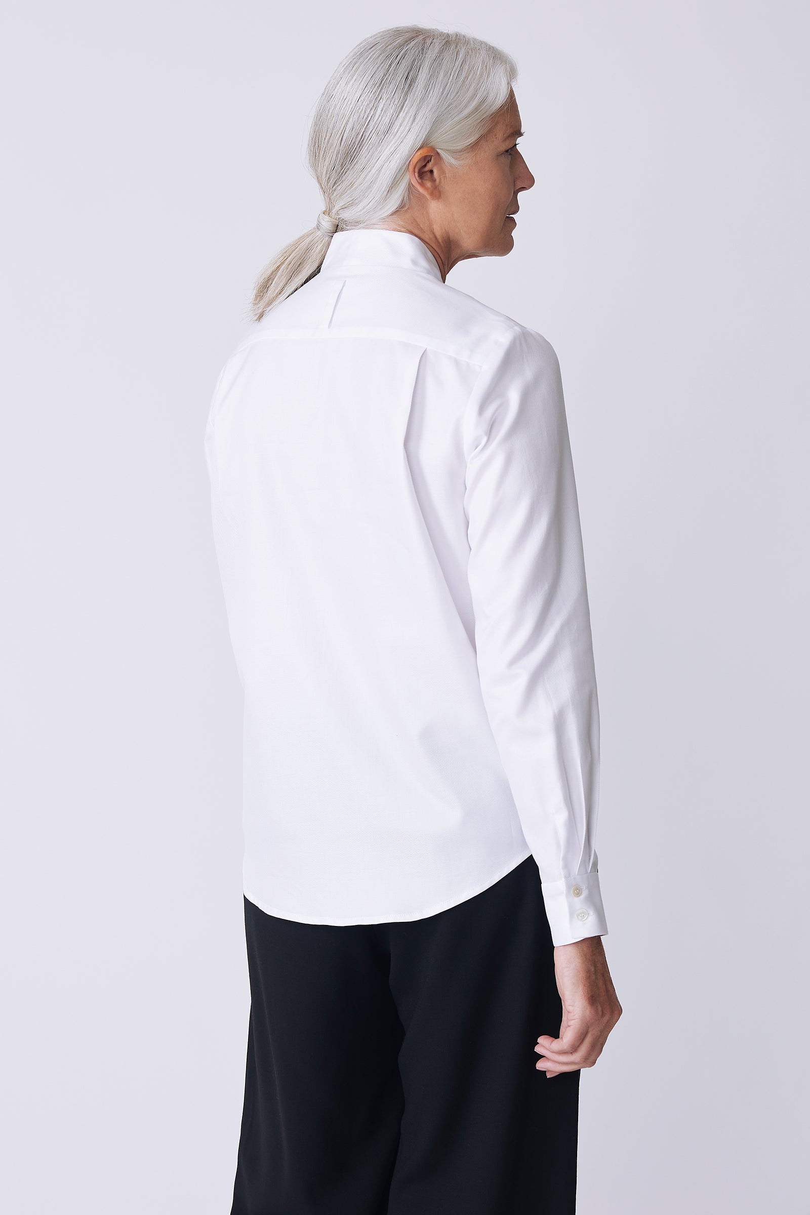 Kal Rieman Nadia Blouse in soft twill white on model front view holding cuff