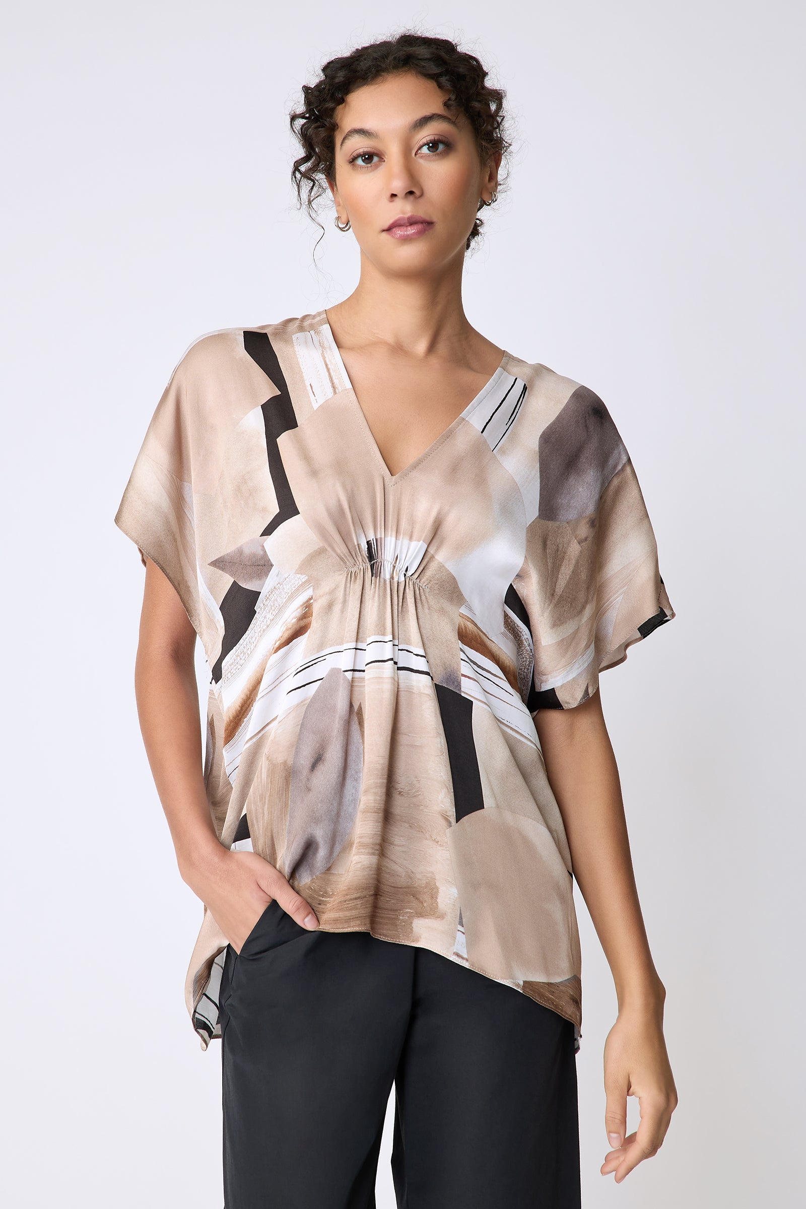 Kal Rieman Paloma Top in Sante Fe print Sand on model front view hand in pocket