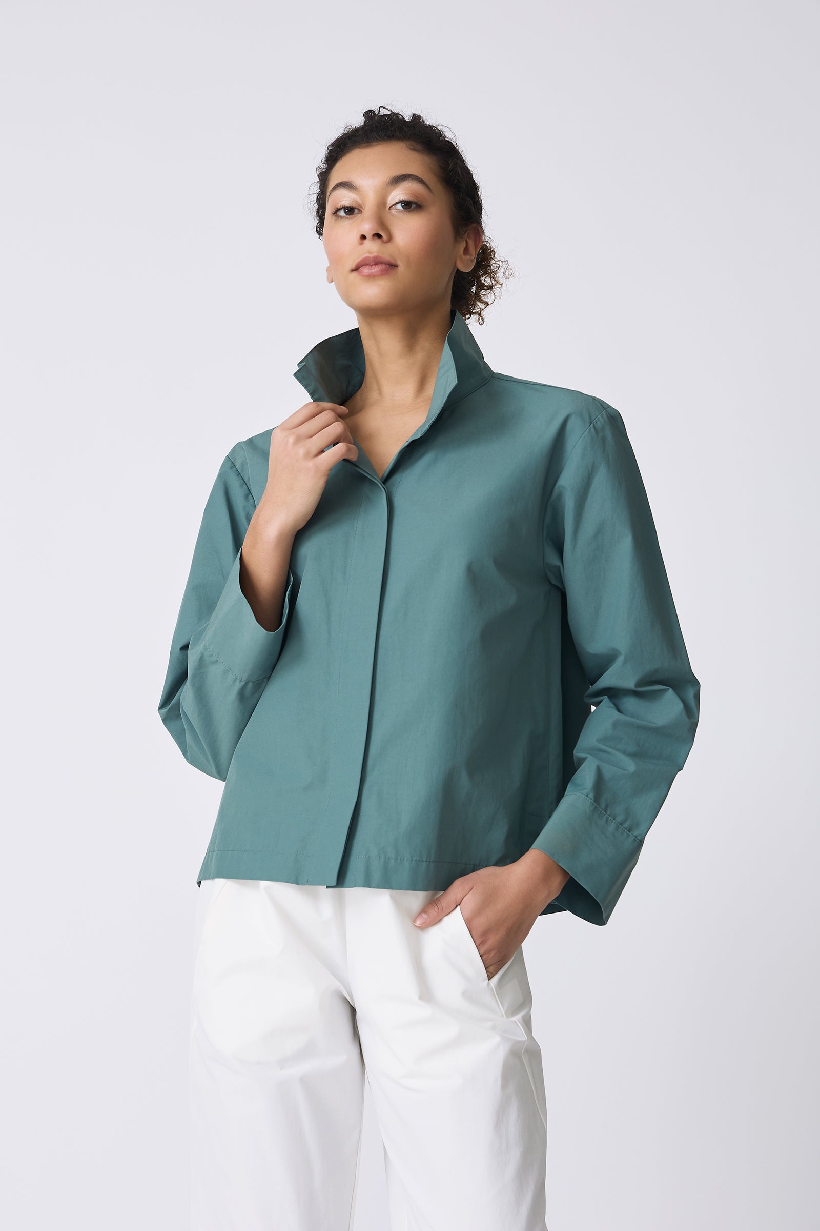 Kal Rieman Peggy Collared Shirt in Sage on model touching collar front view