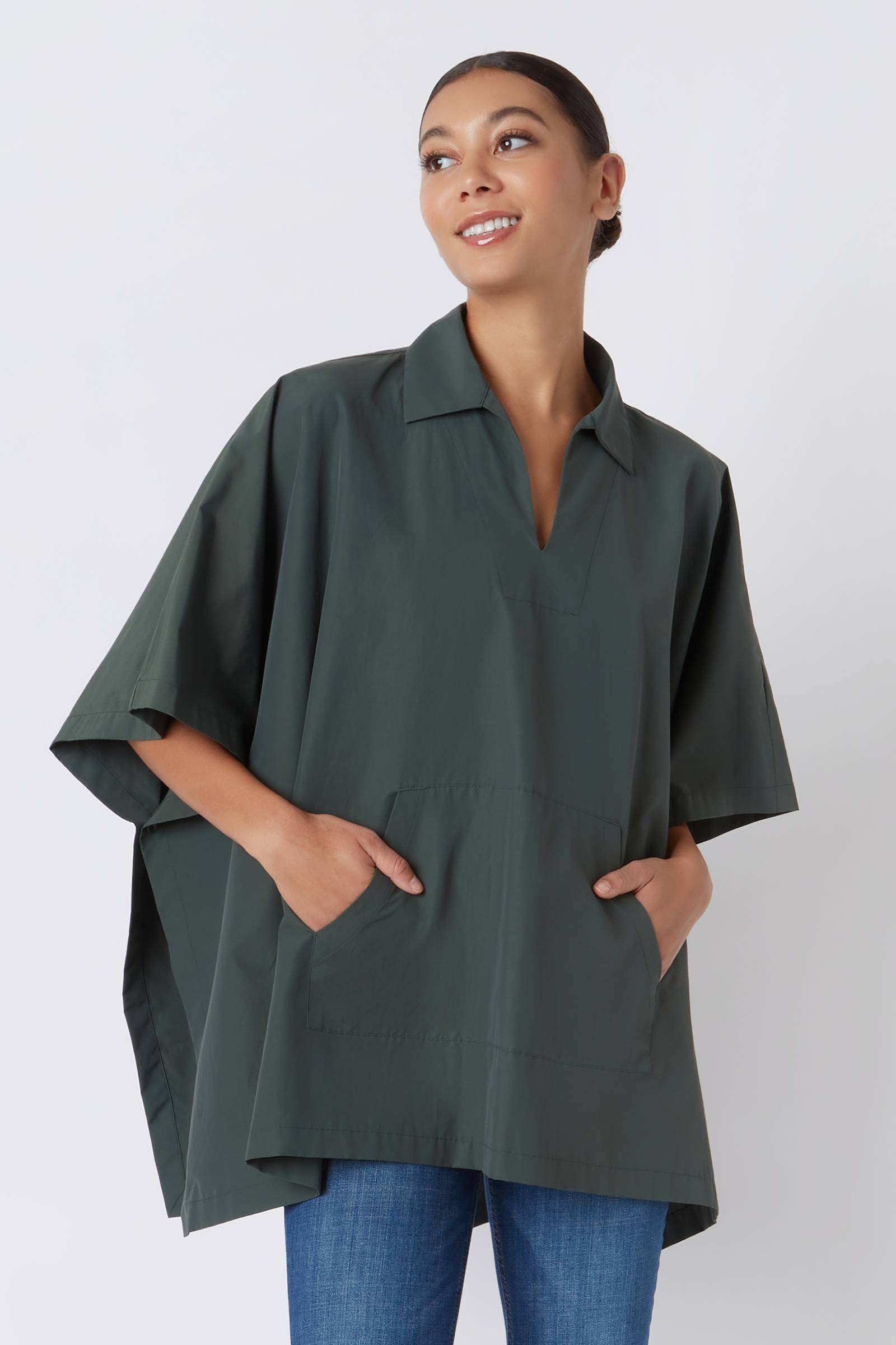 Kal Rieman Pocket Poncho in Loden on Model with Hands in Pocket Cropped Front View