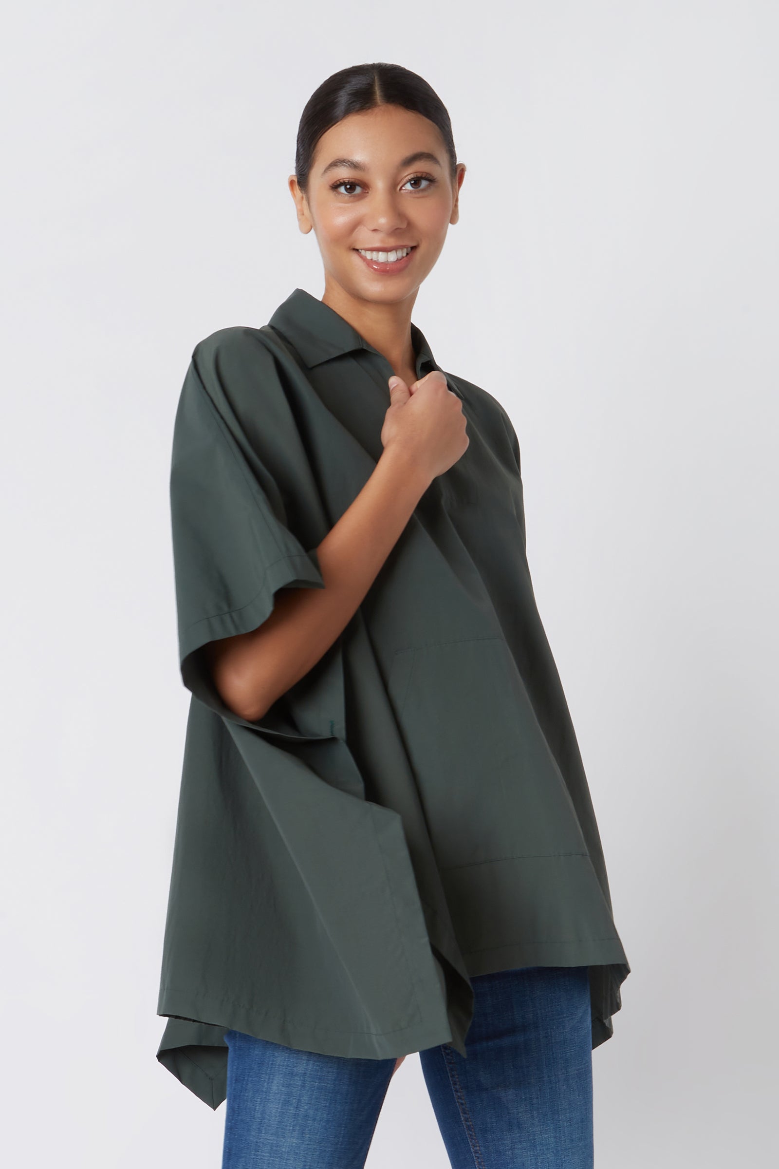 Kal Rieman Pocket Poncho in Loden on Model Hand on Shirt Cropped Front View