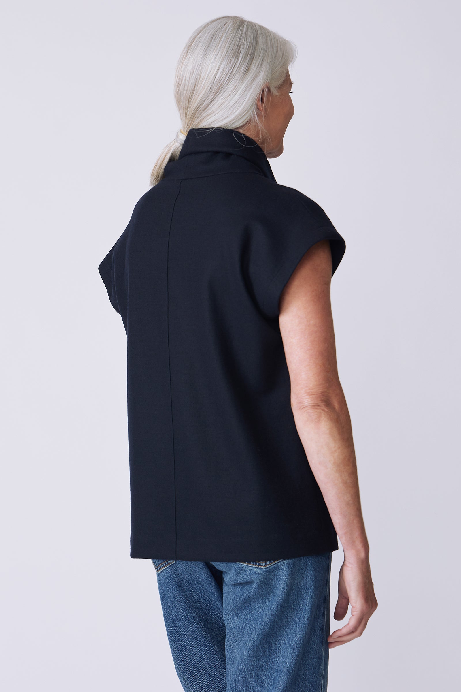 Kal Rieman Raw Edge Seam Tneck in Midnight Felted Jersey on model front view walking