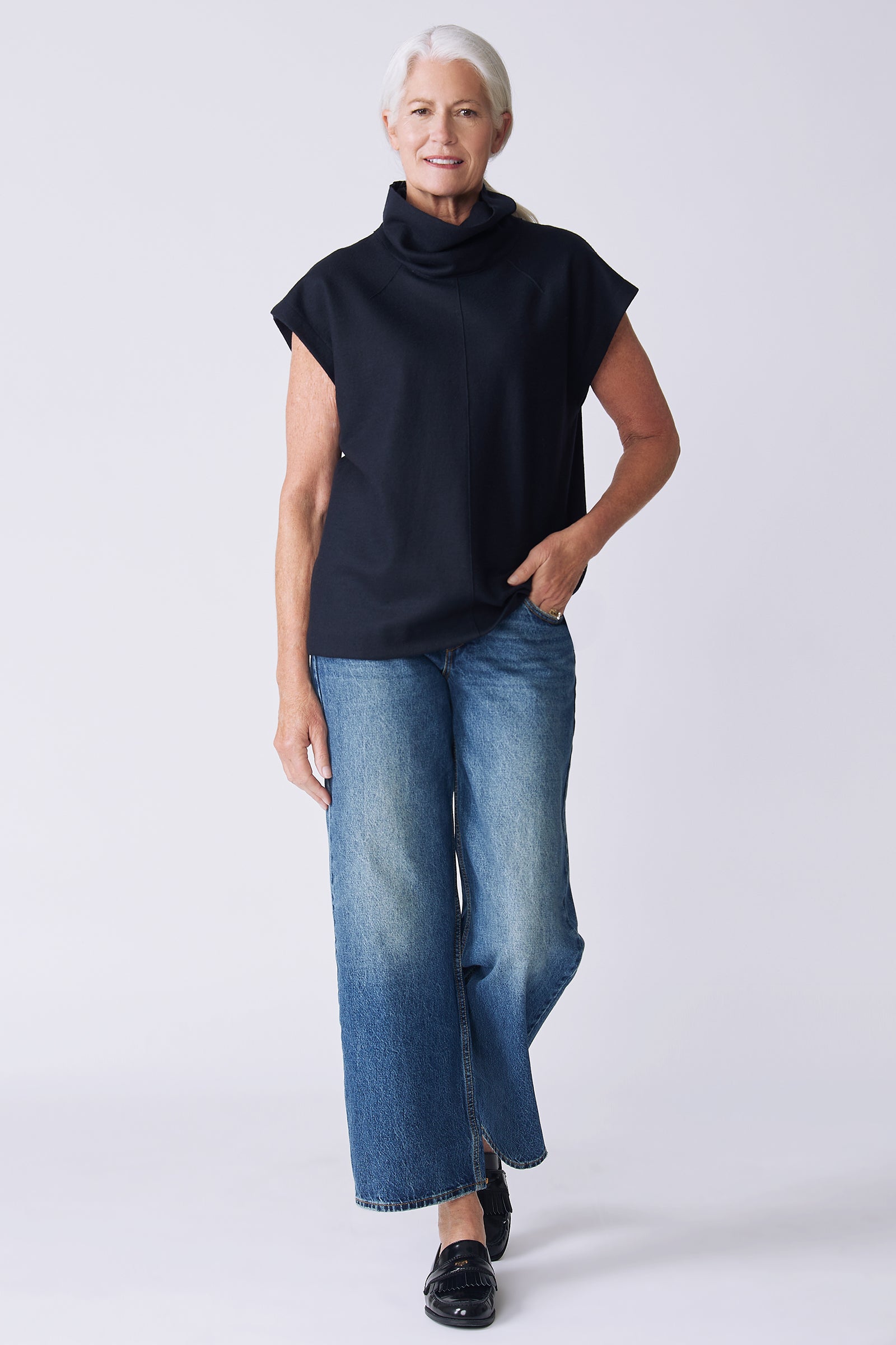 Kal Rieman Raw Edge Seam Tneck in Midnight Felted Jersey on model front view walking