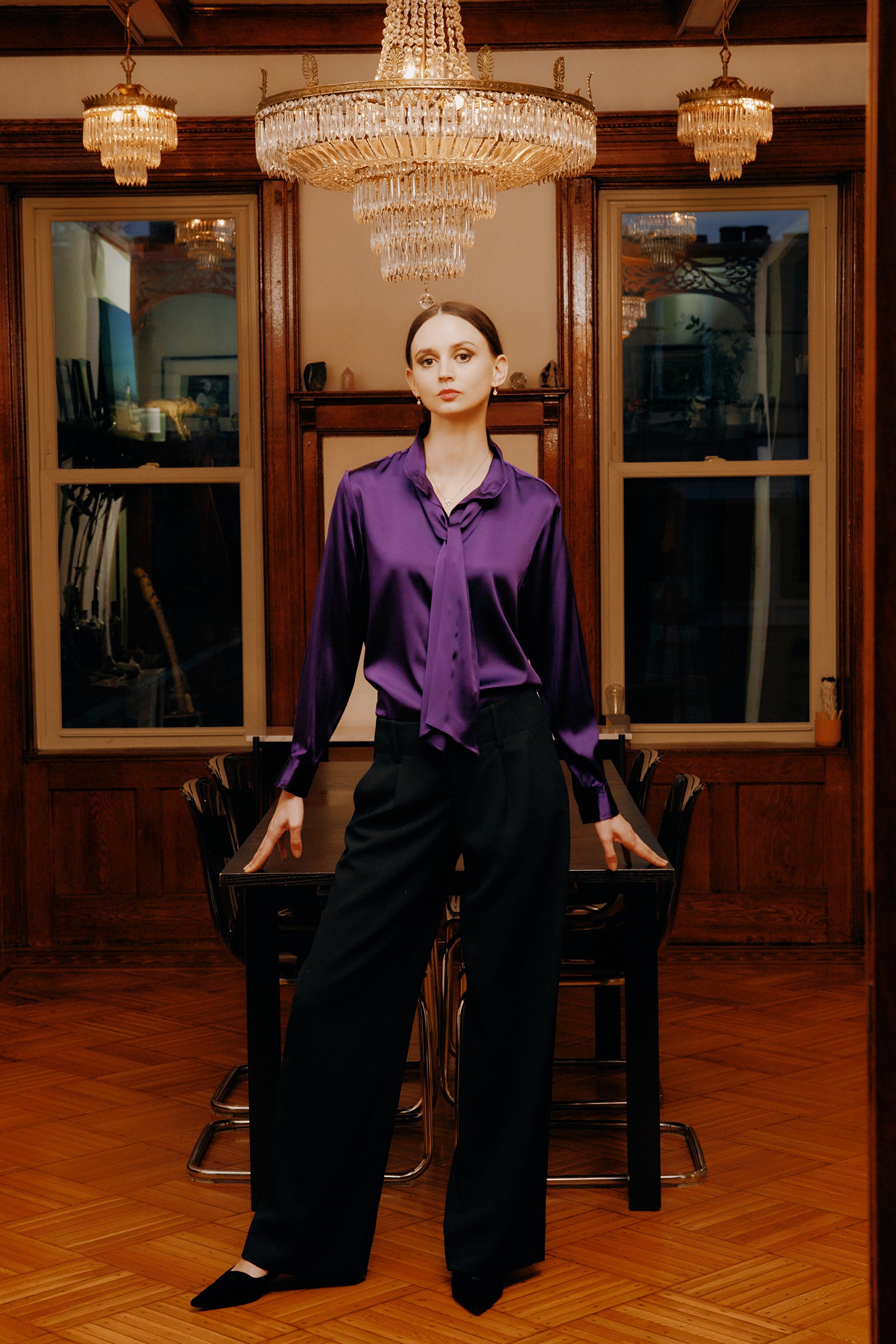 Kal Rieman Regency Silk Blouse in royal purple color charmeuse on model front view hands in pockets walking