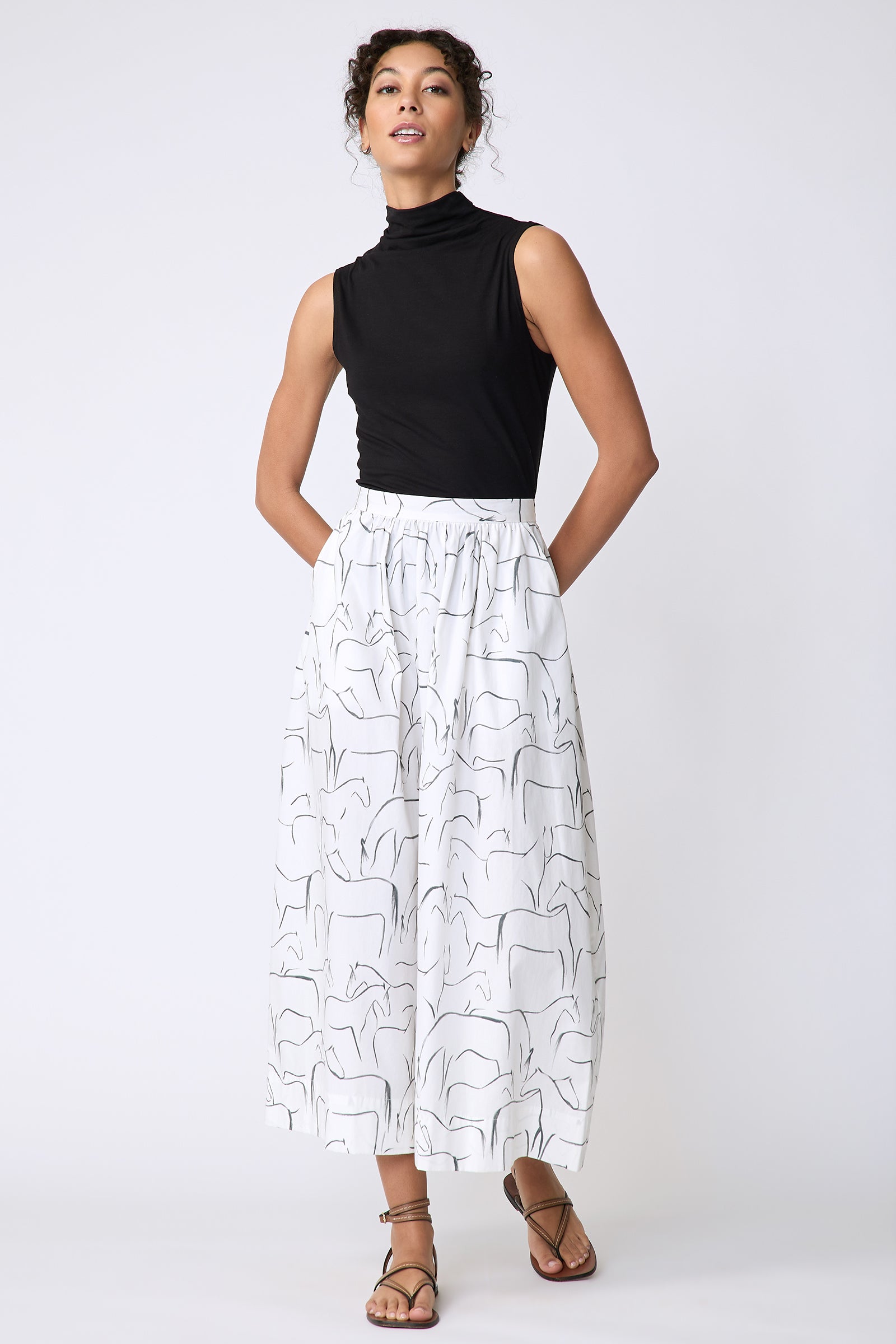 Kal Rieman Sadie Skirt in Italian Horse Print on model front view walking hands behind back