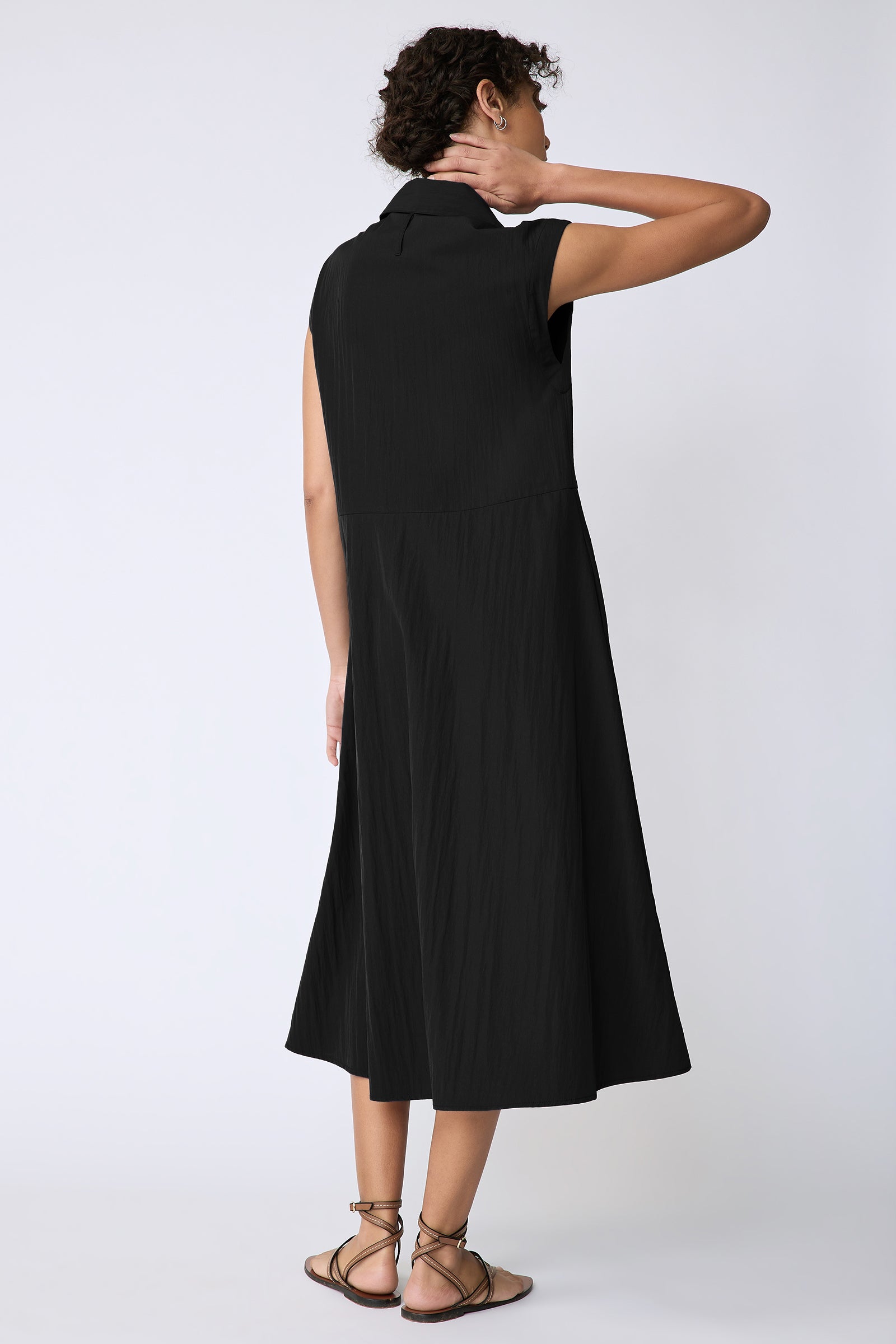 Kal Rieman Savannah Dress in black typewriter cloth on model holding collar