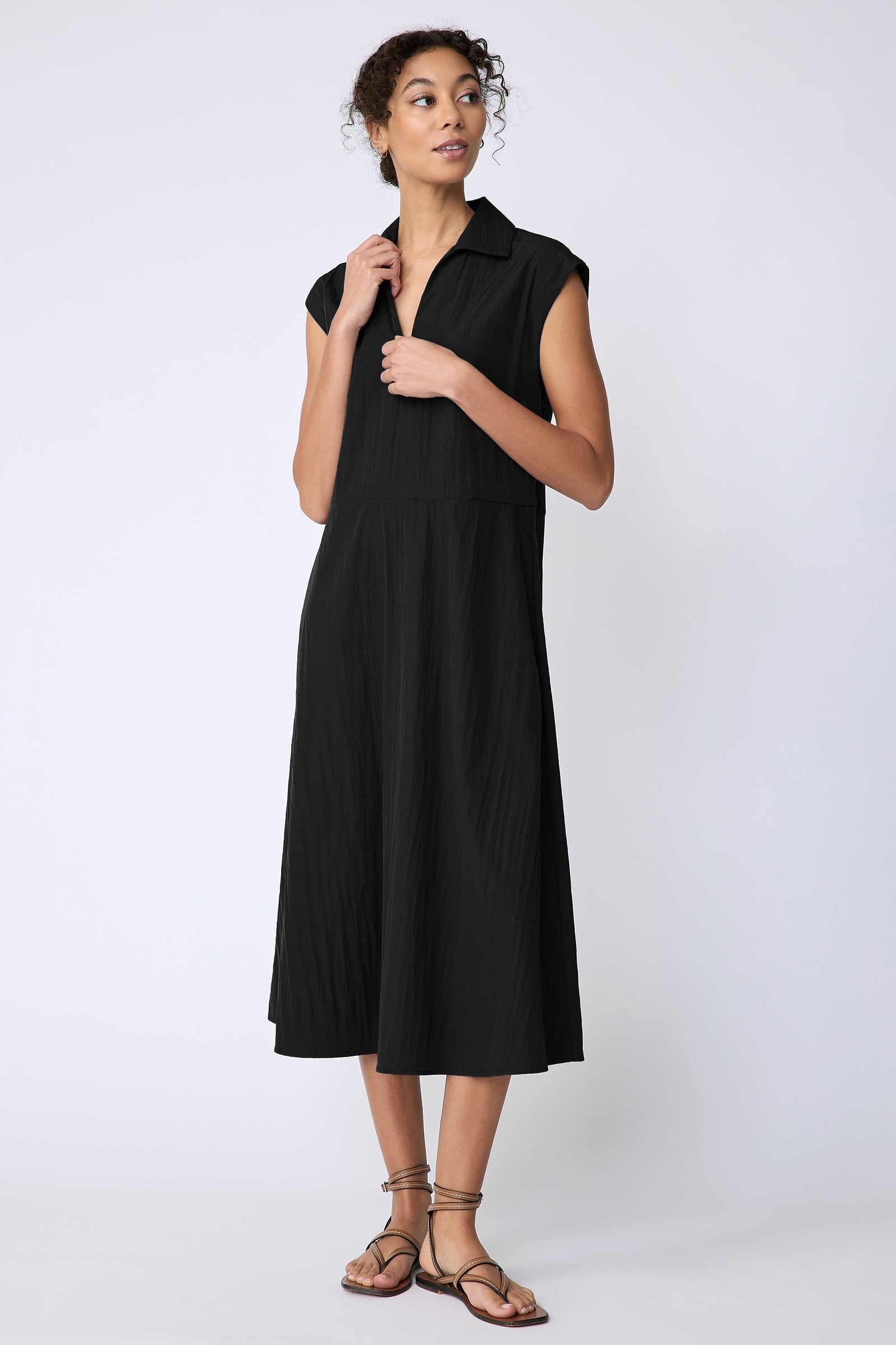 Kal Rieman Savannah Dress in black typewriter cloth on model holding collar