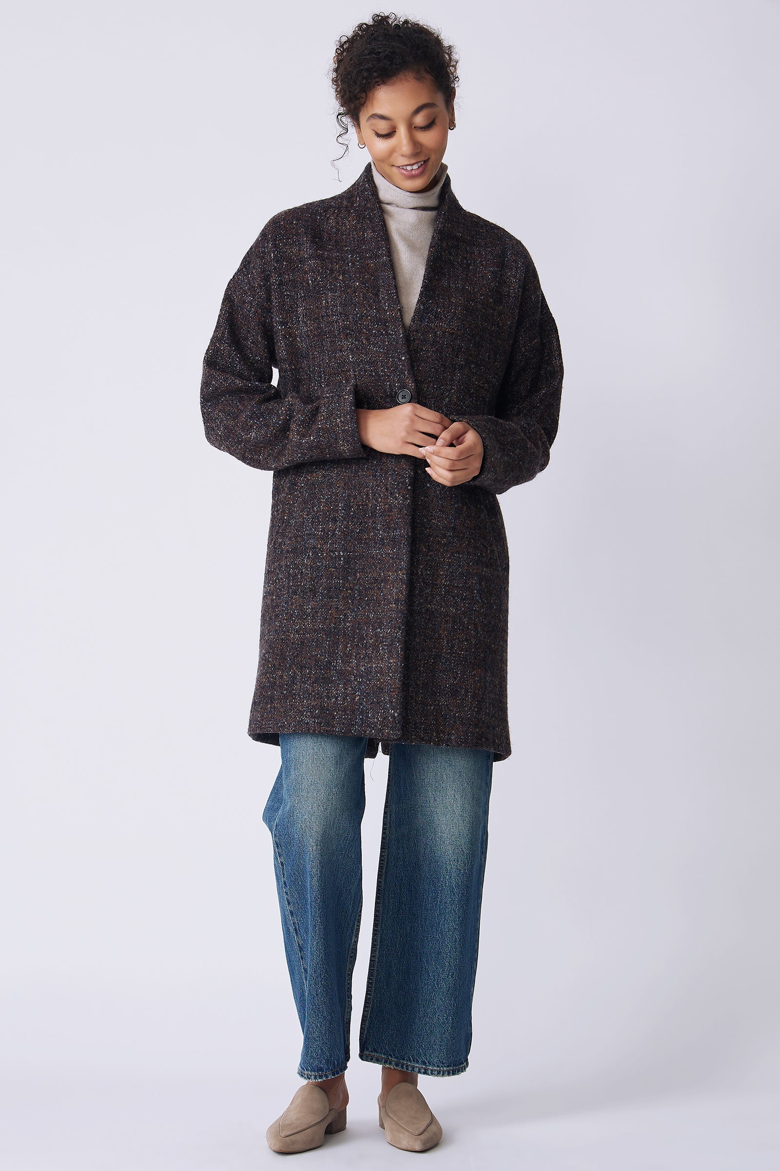 Kal Rieman Sloan Coat in multi on model front view walking hands in front