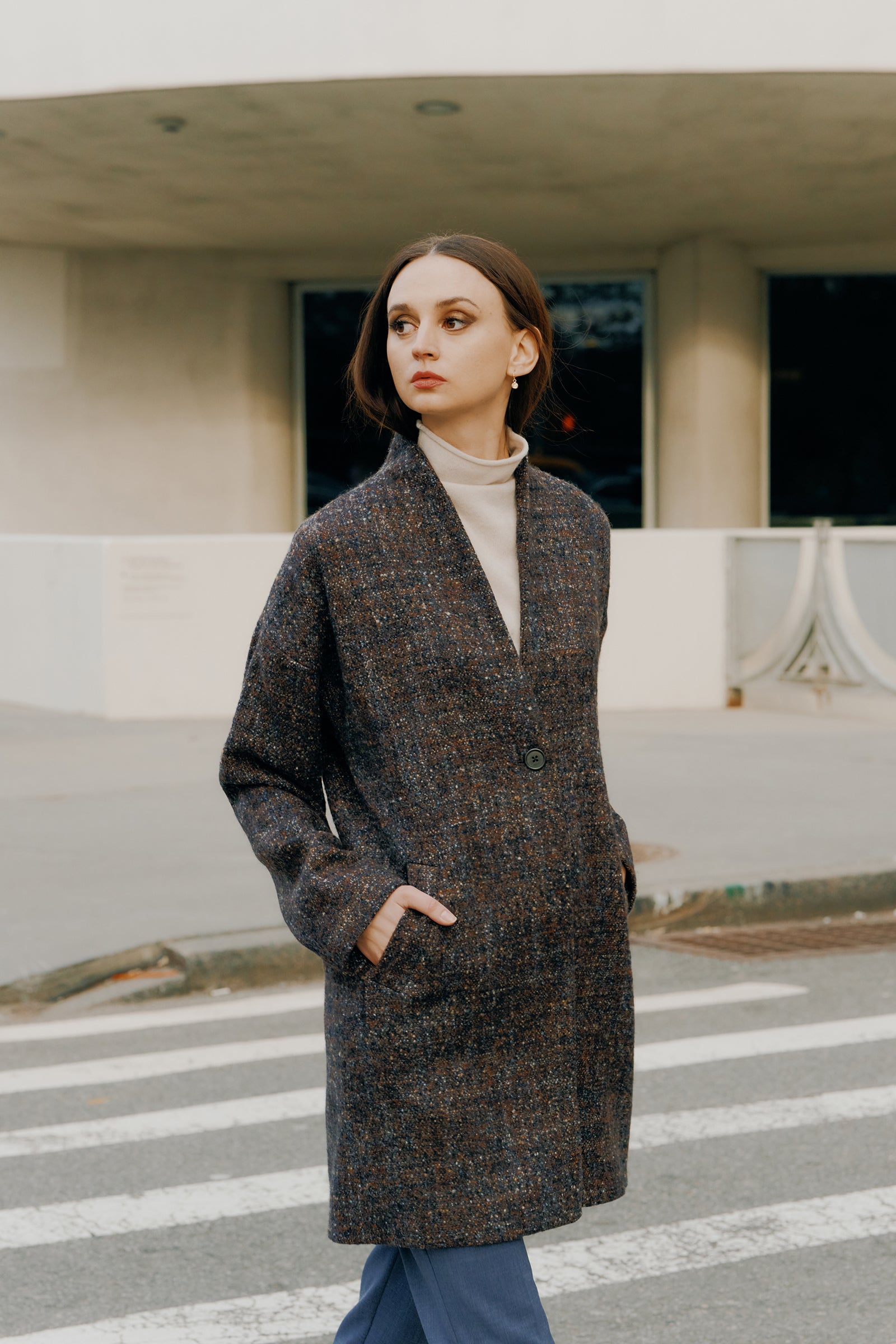 Kal Rieman Sloan Coat in multi on model front view walking hands in front