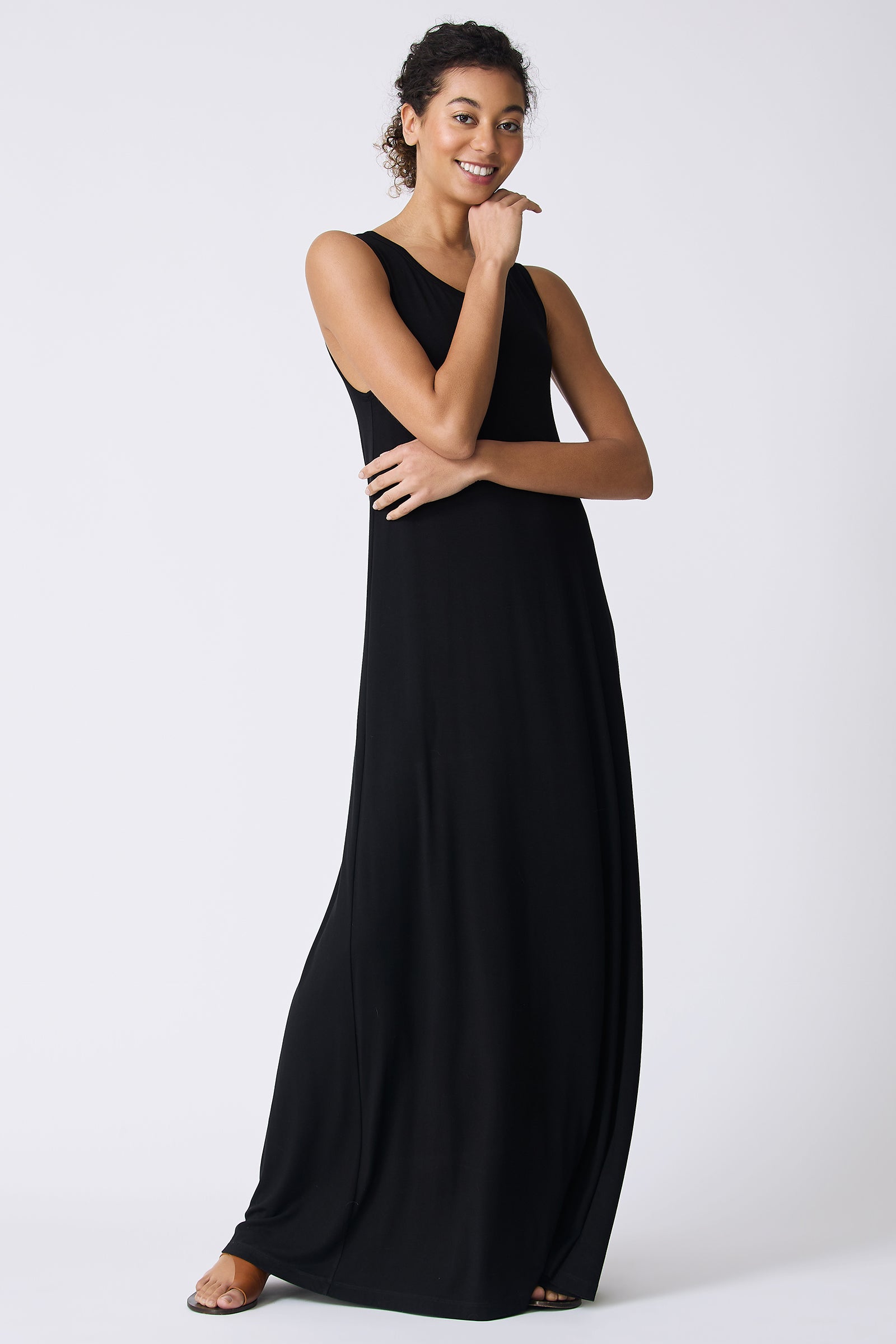 Kal Rieman Sophia Maxi Dress in Black on model with hand under chin full front view