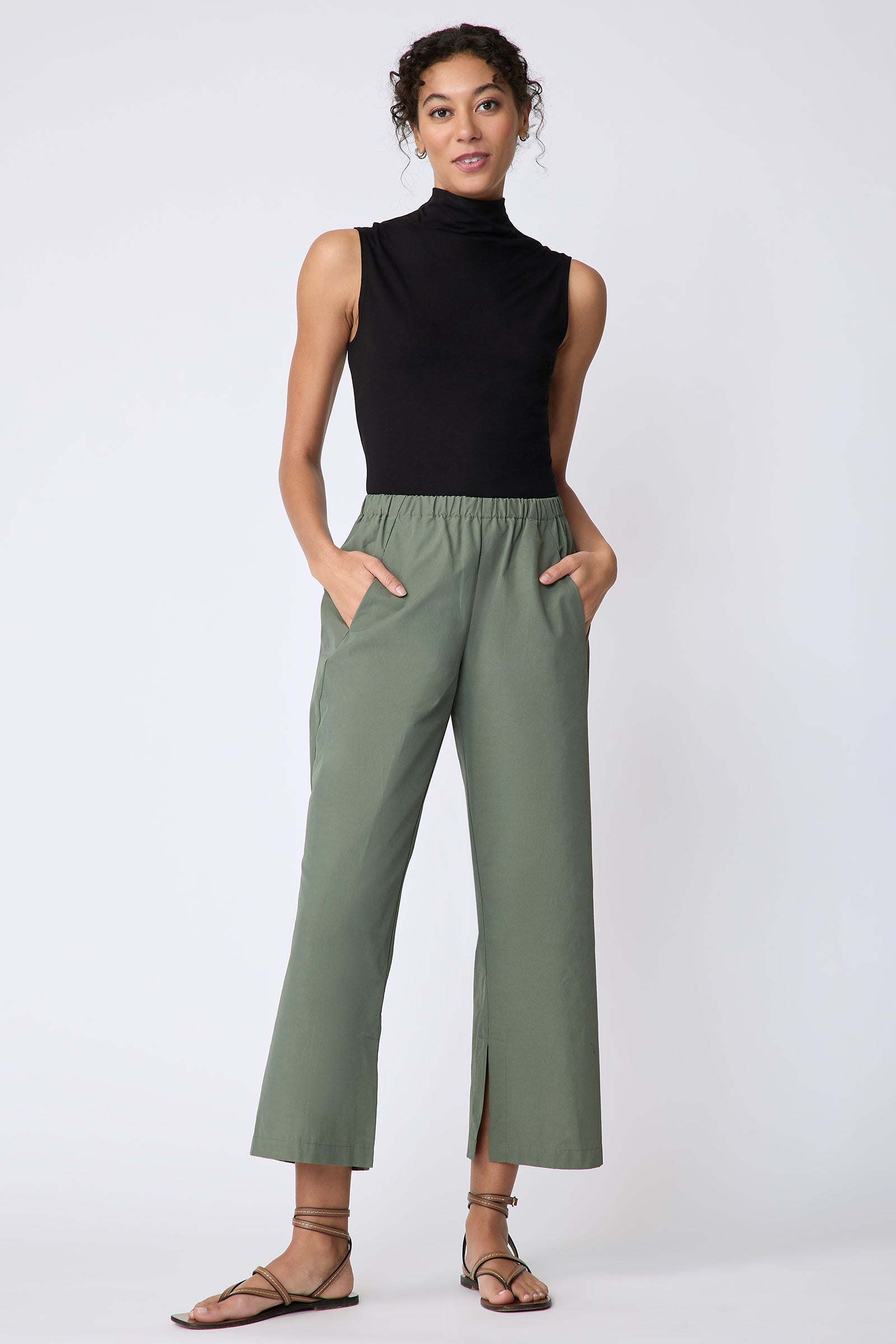 Kal Rieman Split Hem Capri in Cactus Broadcloth on model front view hands in pockets smiling