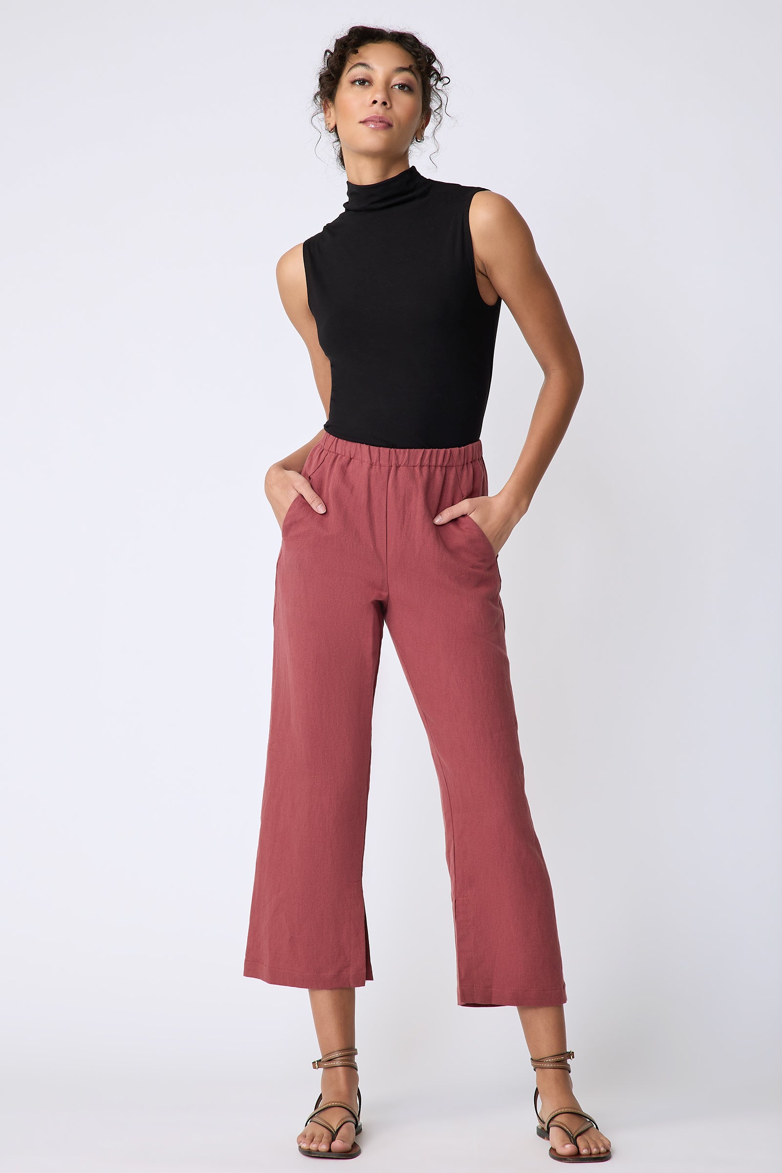 Kal Rieman Split Hem Capri in Terracotta cotton linen on model front view hands in pockets