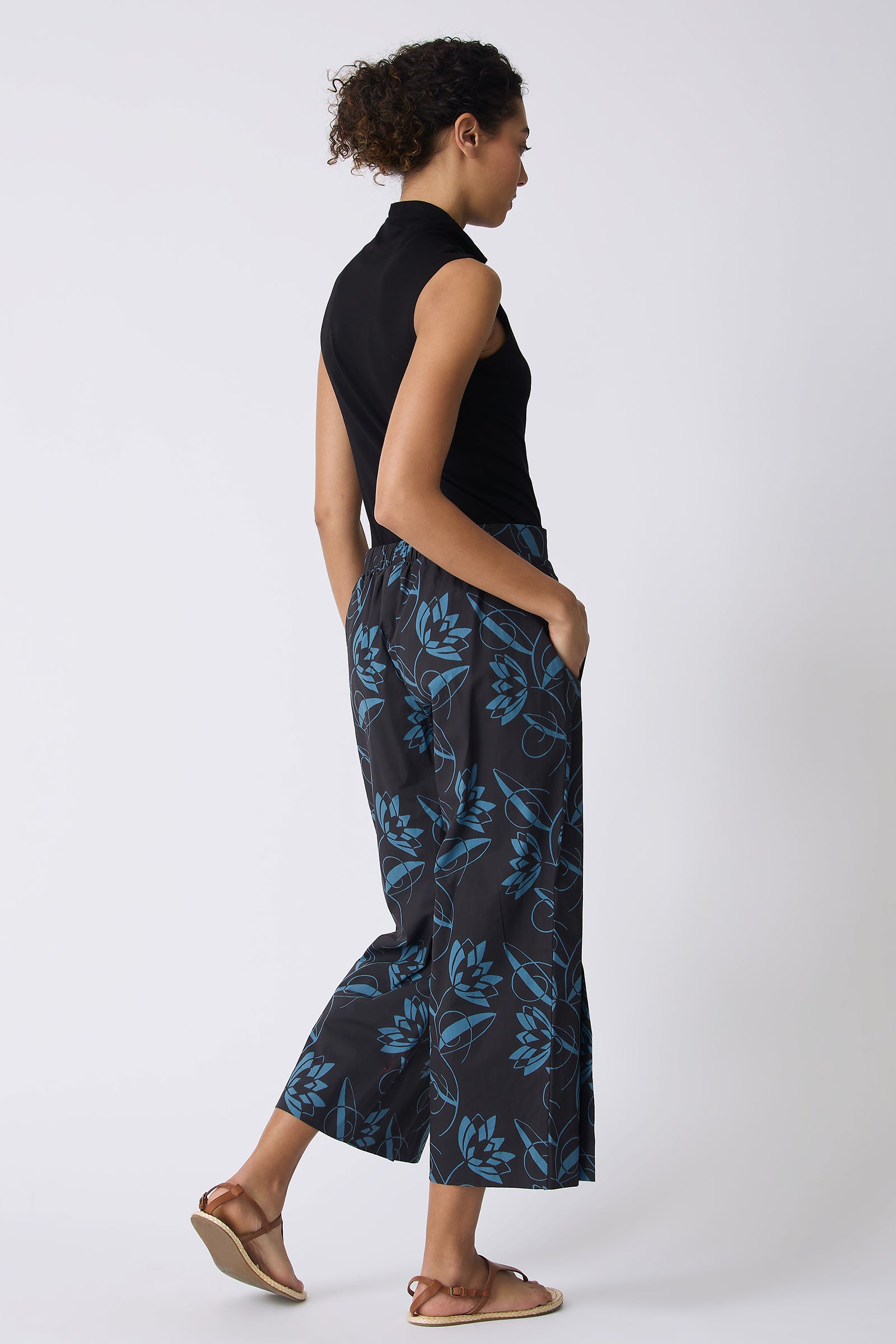 Kal Rieman Tami Side Kick Pant in Lotus Print Blue on model with left hand on hip
