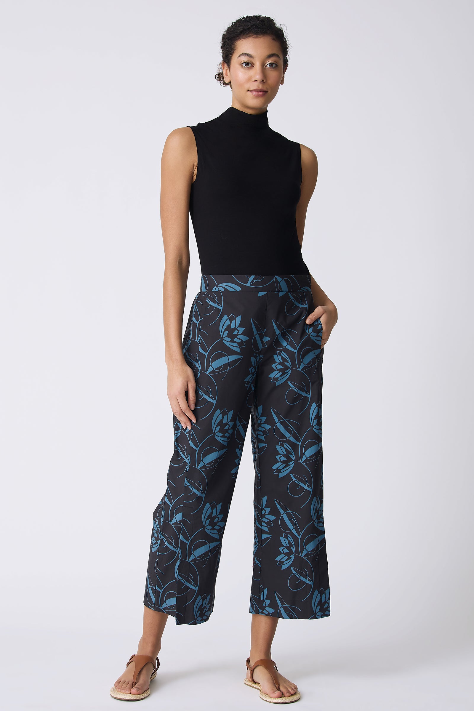 Kal Rieman Tami Side Kick Pant in Lotus Print Blue on model with left hand in pocket