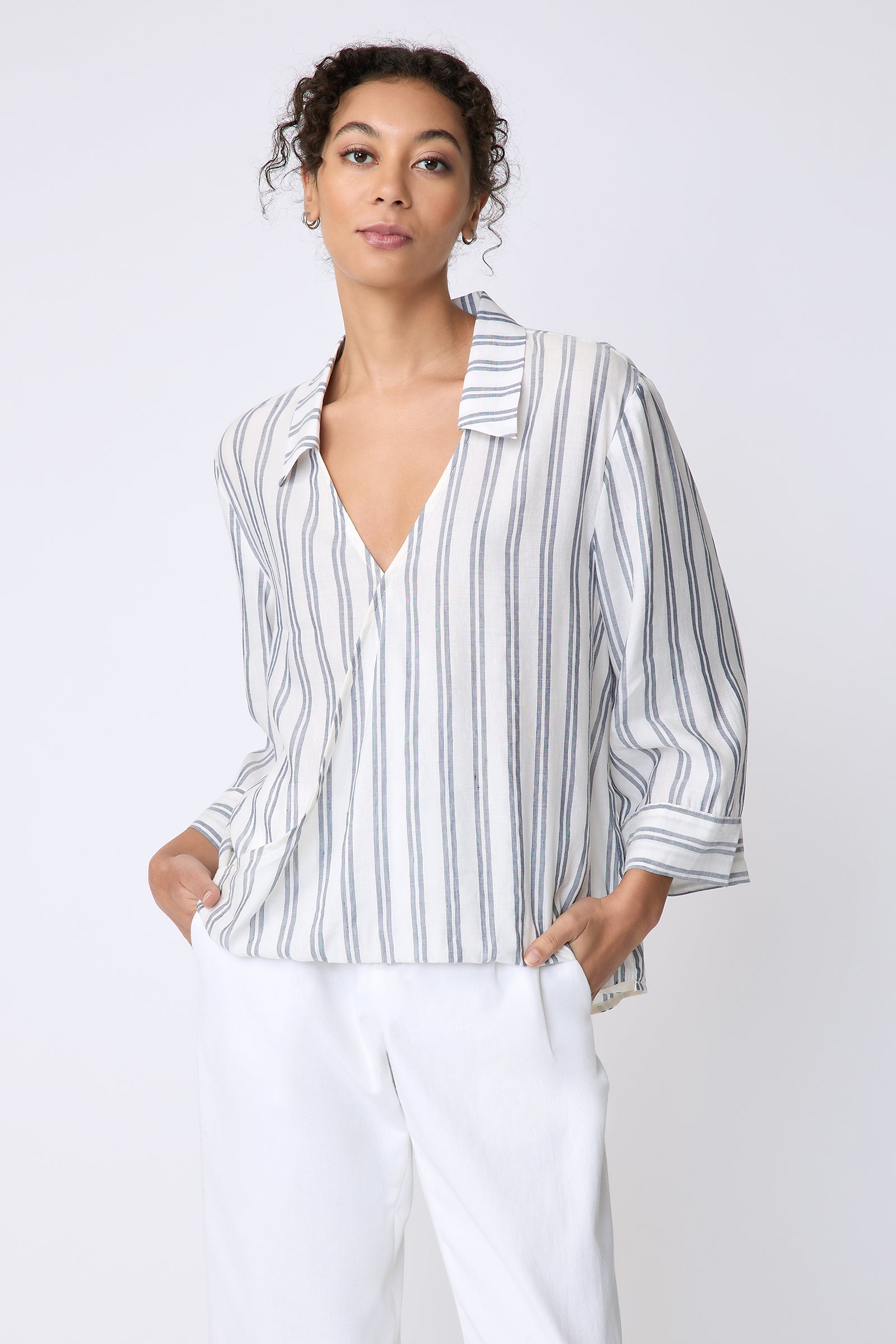 Kal Rieman Tropez Pullover in navy stripe on model front view hands in pockets