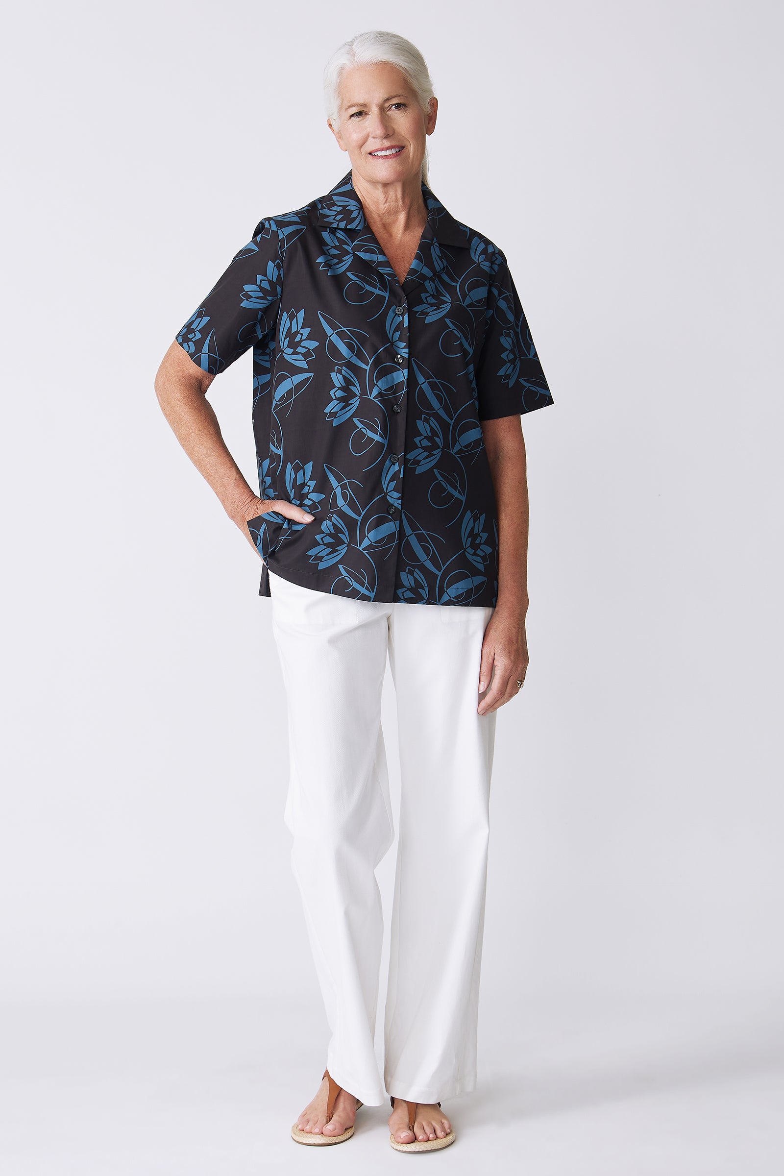 Kal Rieman Vacation Shirt in Lotus Print Blue on model with hand on hip front view