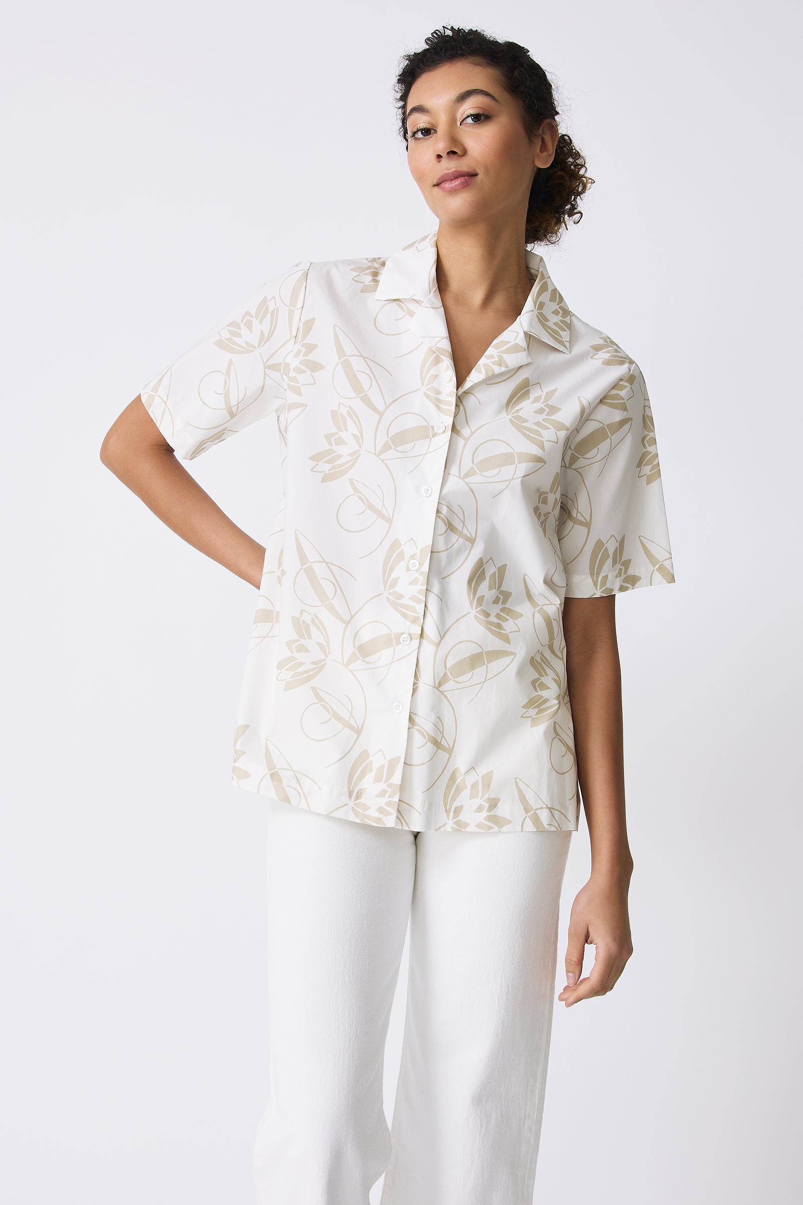 Kal Rieman Vacation Shirt in Lotus Print Sand on model with hand behind back front view