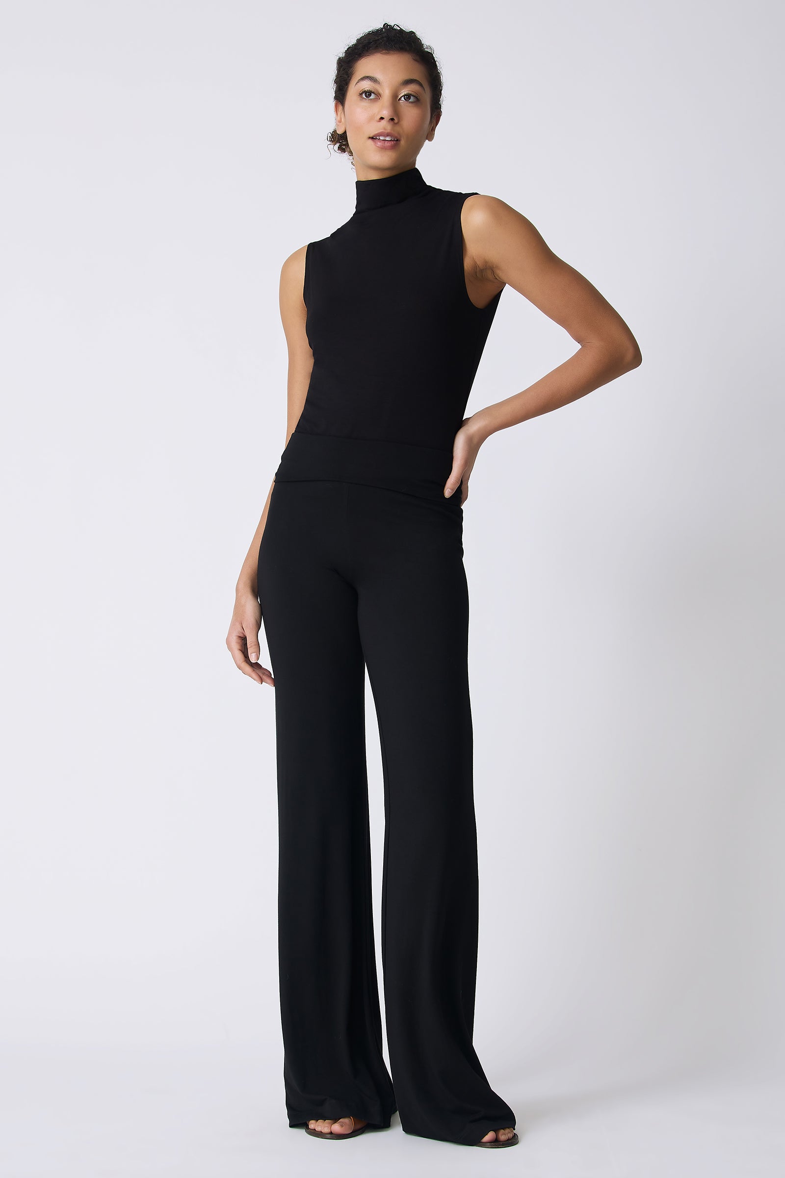 Kal Rieman Zoe Jersey Wide Leg Pant in Black on model with hand on hip full front view