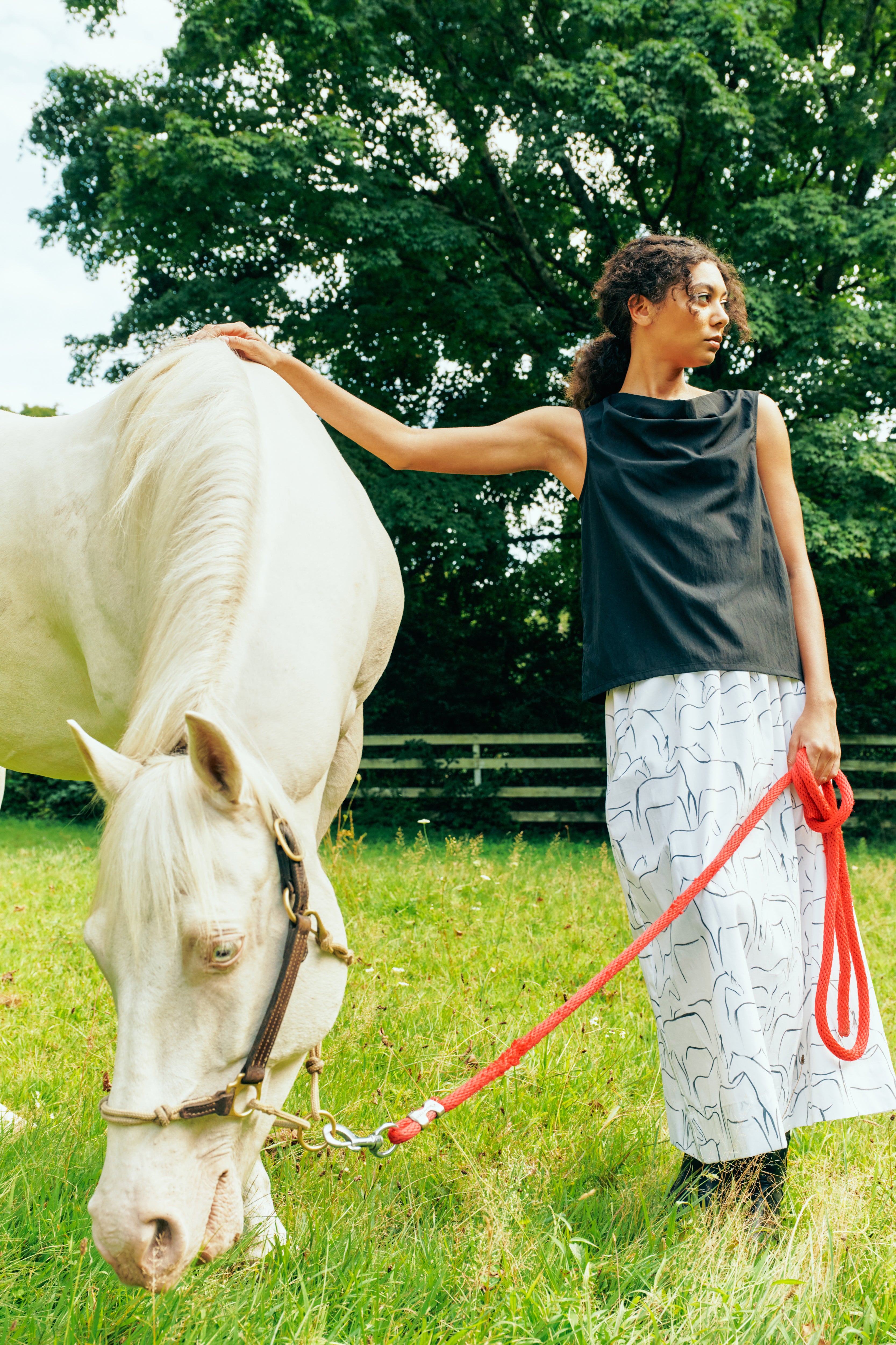 Kal Rieman Sadie Skirt in Italian Horse Print on model front view walking hands behind back