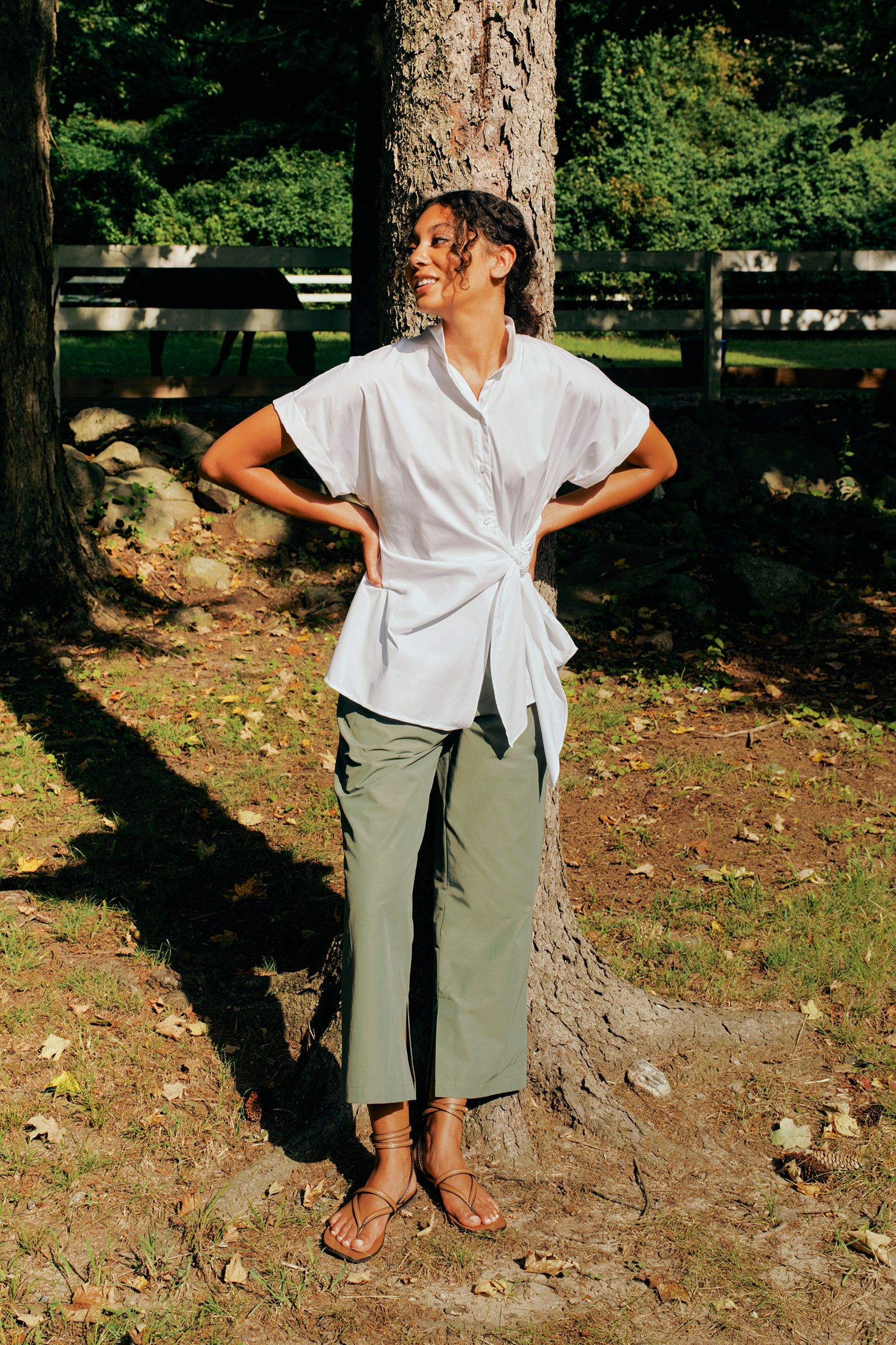Kal Rieman Split Hem Capri in Cactus Broadcloth on model front view hands in pockets smiling