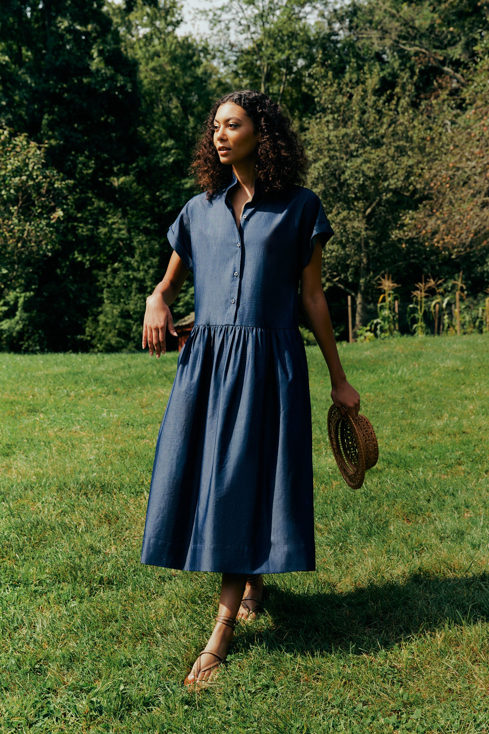 Kal Rieman Tanya Dress in Indigo light weight denim on model front view holding collar