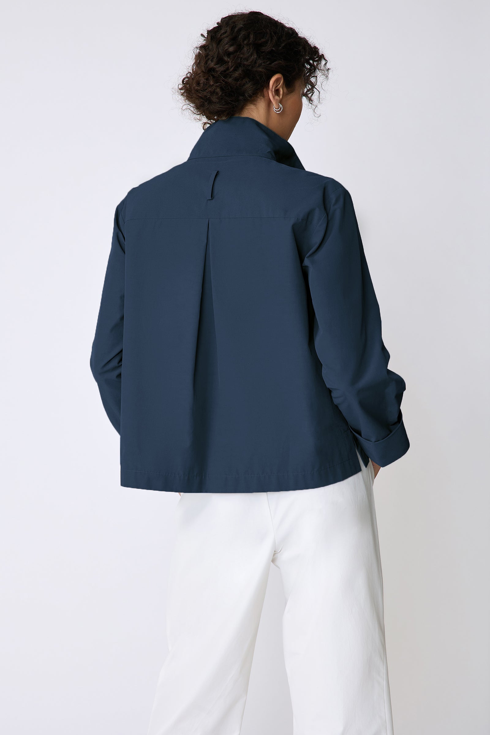 Peggy jacket in Italian Broadcloth in color summer navy on model front view holding collar