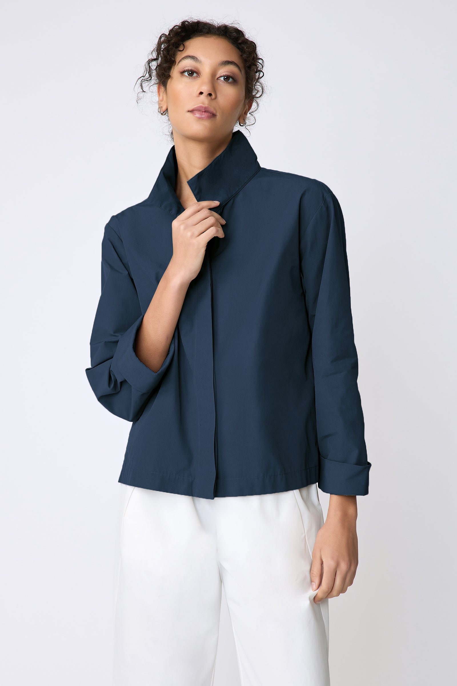 Peggy jacket in Italian Broadcloth in color summer navy on model front view holding collar