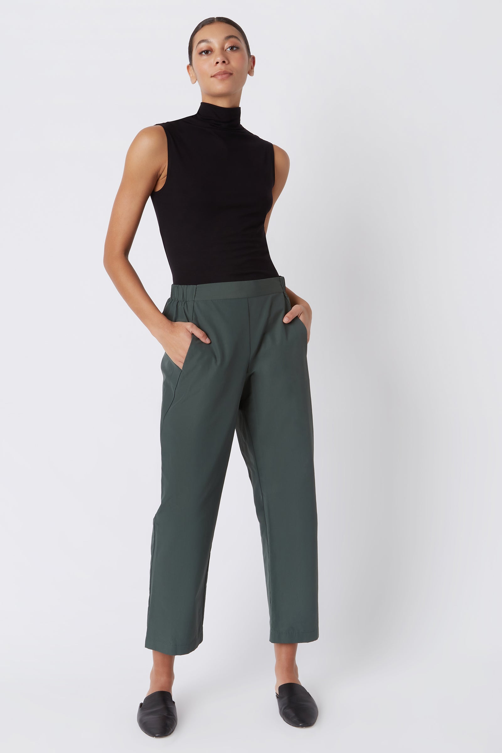Kal Rieman Brit Crop Pant in Loden on Model with Hands in Pockets Full Front View