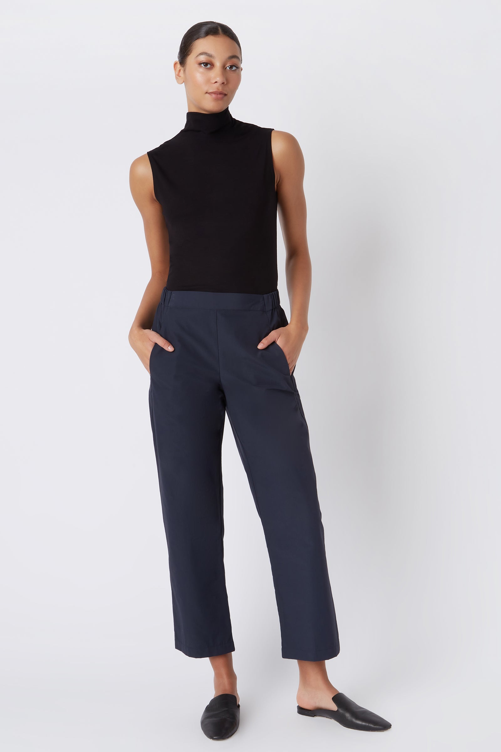 Kal Rieman Brit Crop Pant in Navy on Model with Hands in Pockets Full Front View