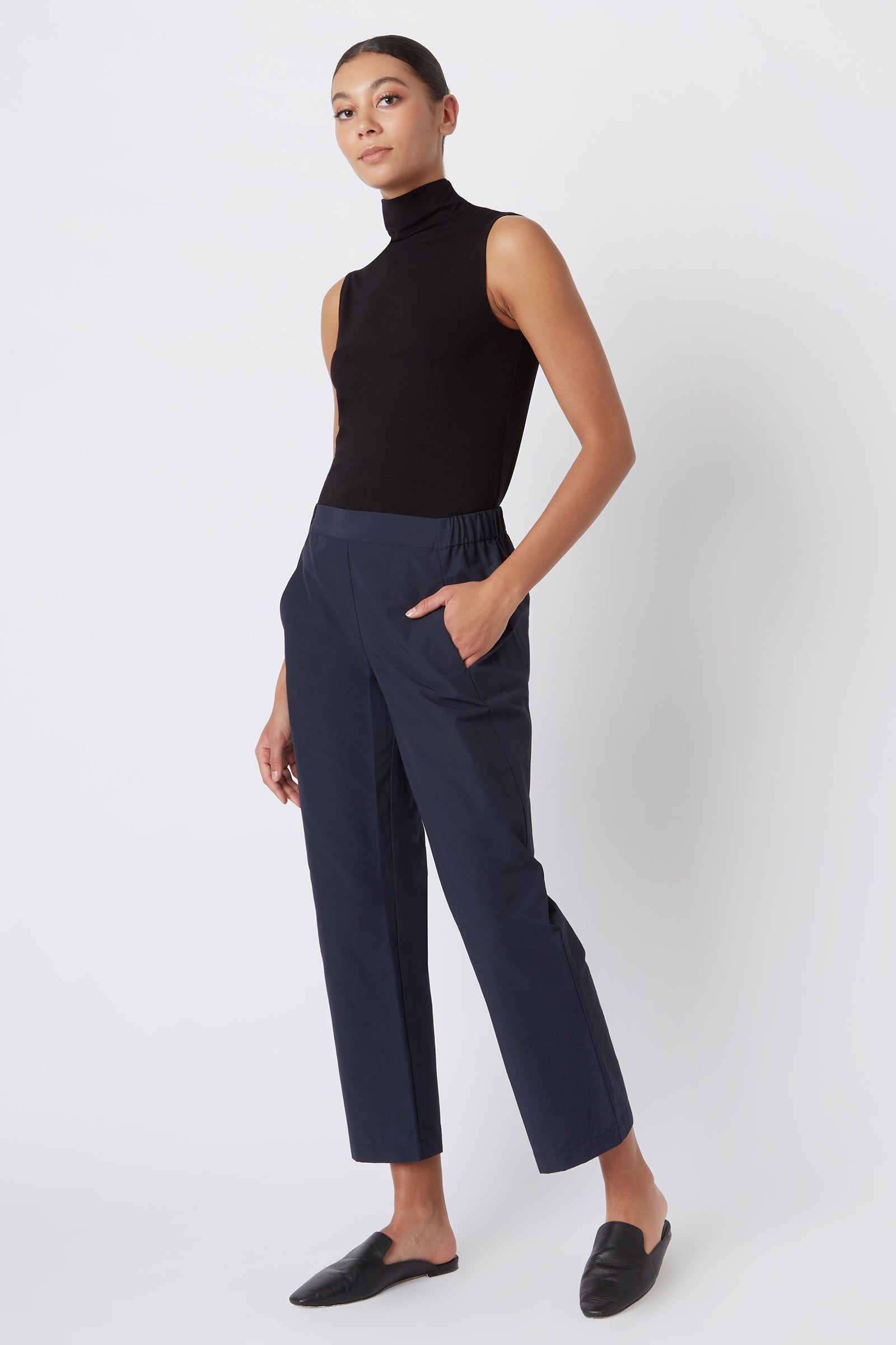 Kal Rieman Brit Crop Pant in Navy on Model with Hand on Pocket Full Front View
