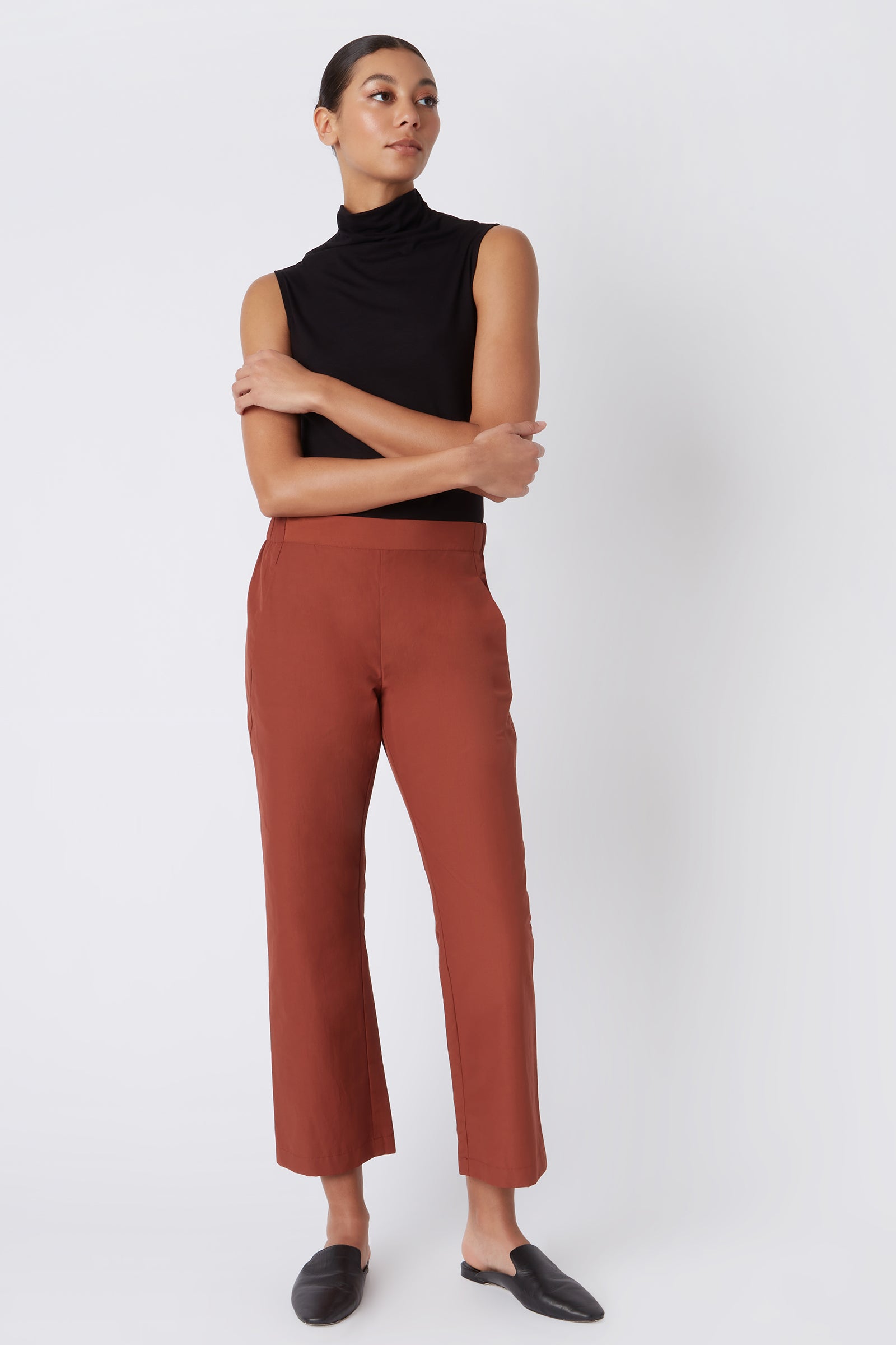 Kal Rieman Brit Crop Pant in Rust Italian Broadcloth on Model with Arms Crossed Full Front View