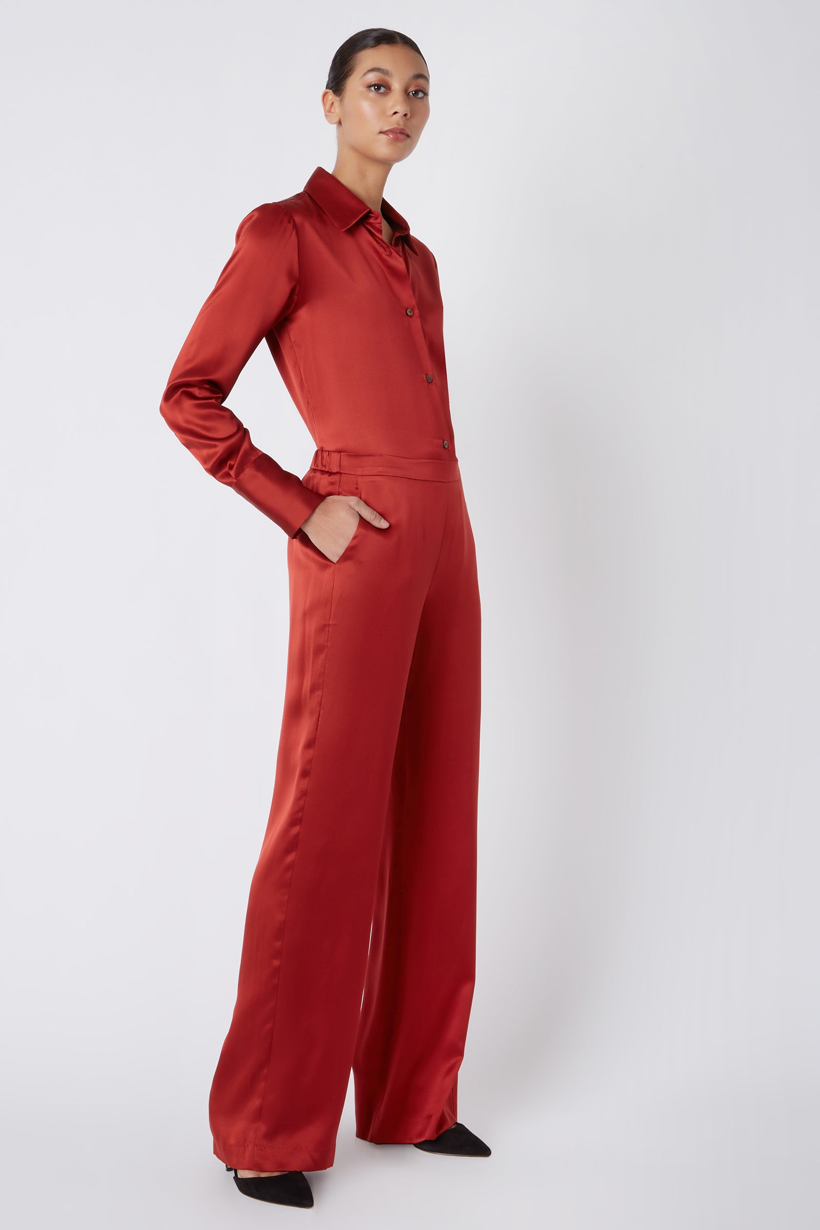 Kal Rieman Classic Silk Trouser in Rust Colored Silk on Model with Hand in Pocket Full Side View