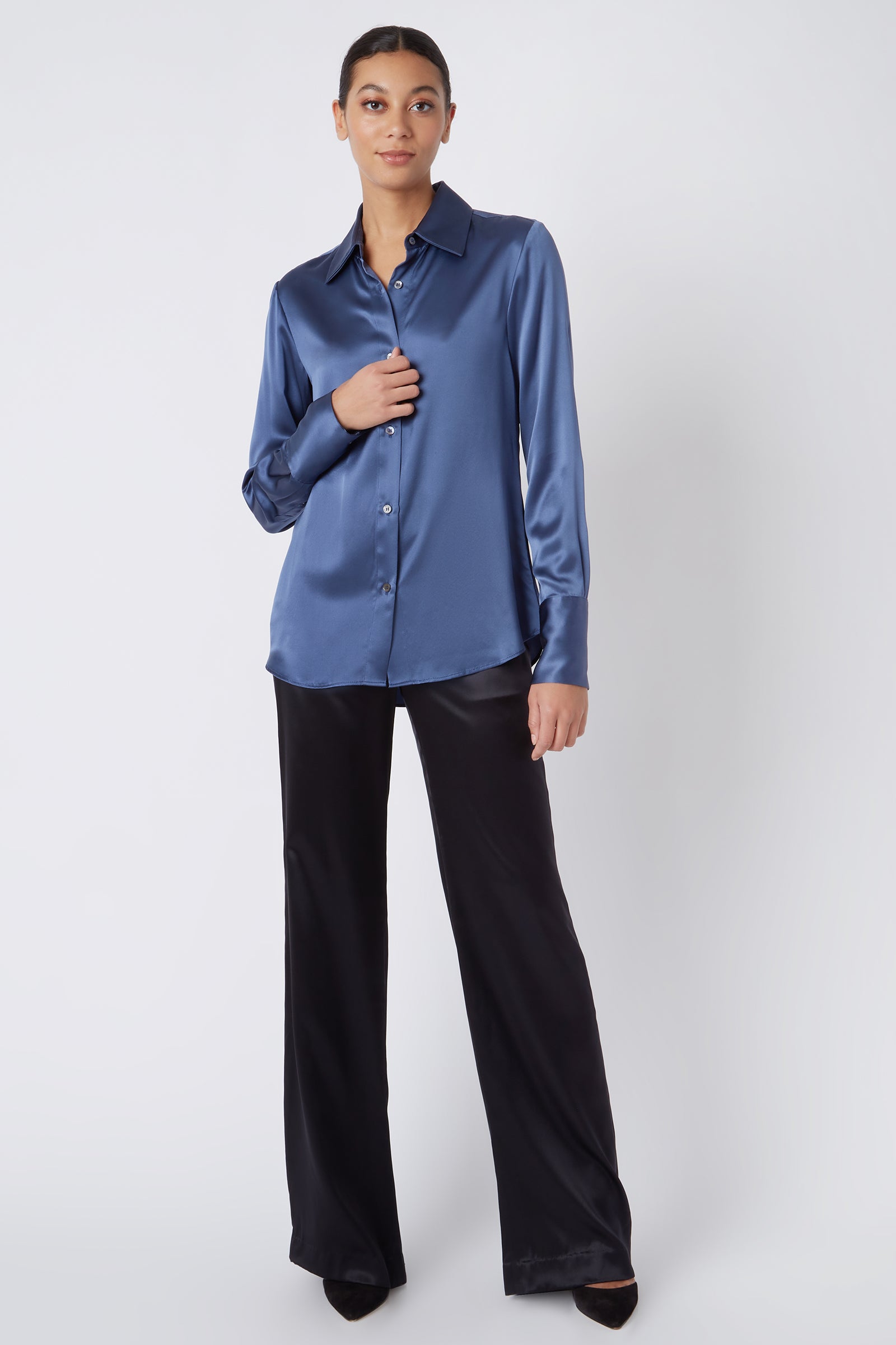 Kal Rieman Classic Tailored Blouse in Dusty Blue Silk on Model Touching Shirt Full Front View
