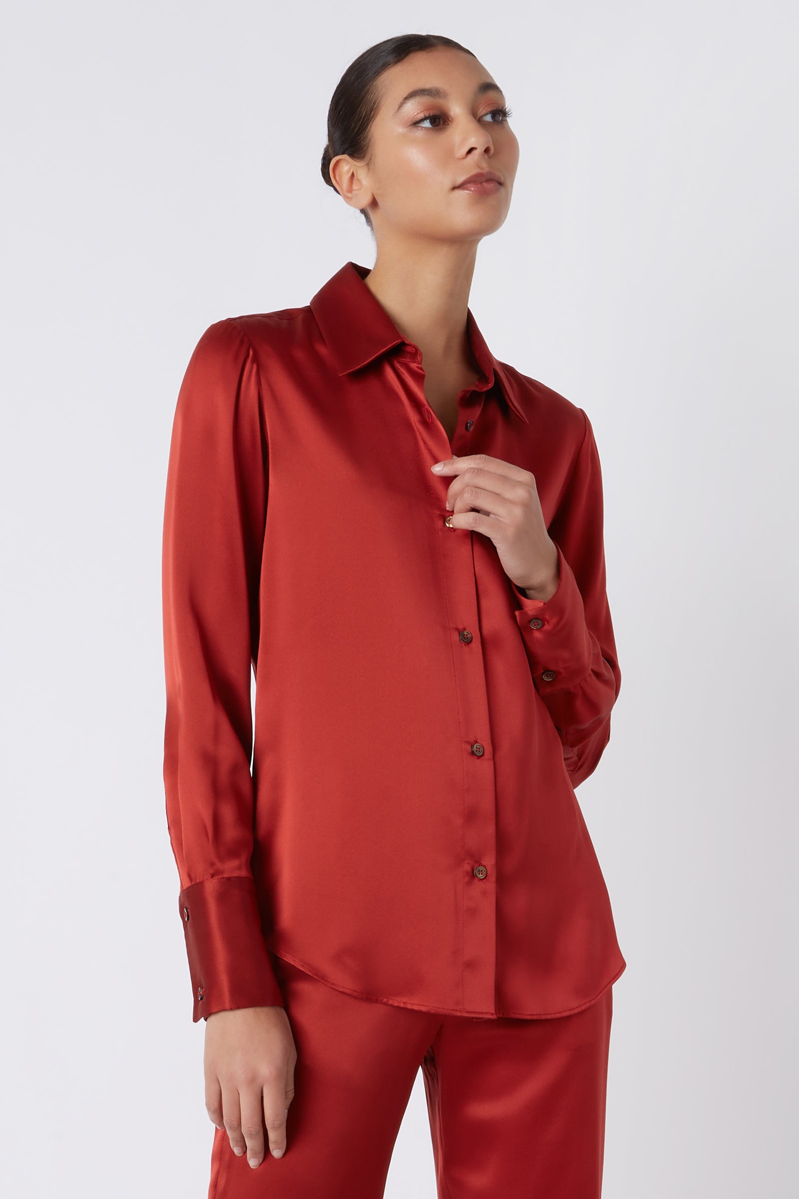 Kal Rieman Classic Tailored Blouse in Rust Silk on Model Head Tilted Up Cropped Front View