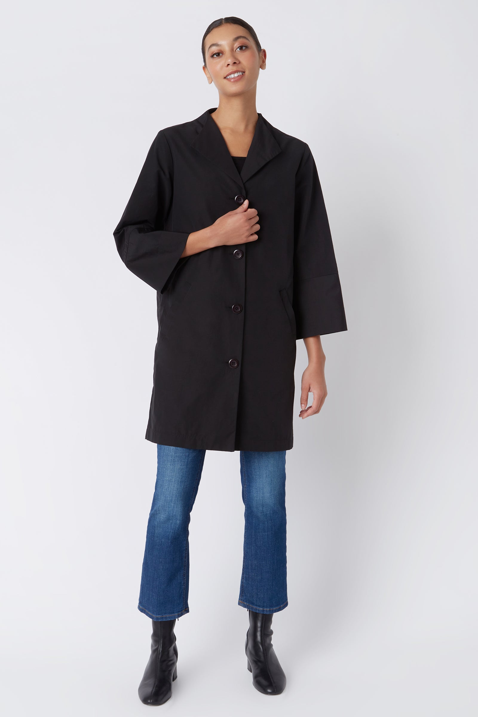 Kal Rieman Else Peacoat in Black Italian Broadcloth on Model with Hand on Coat Full Front View