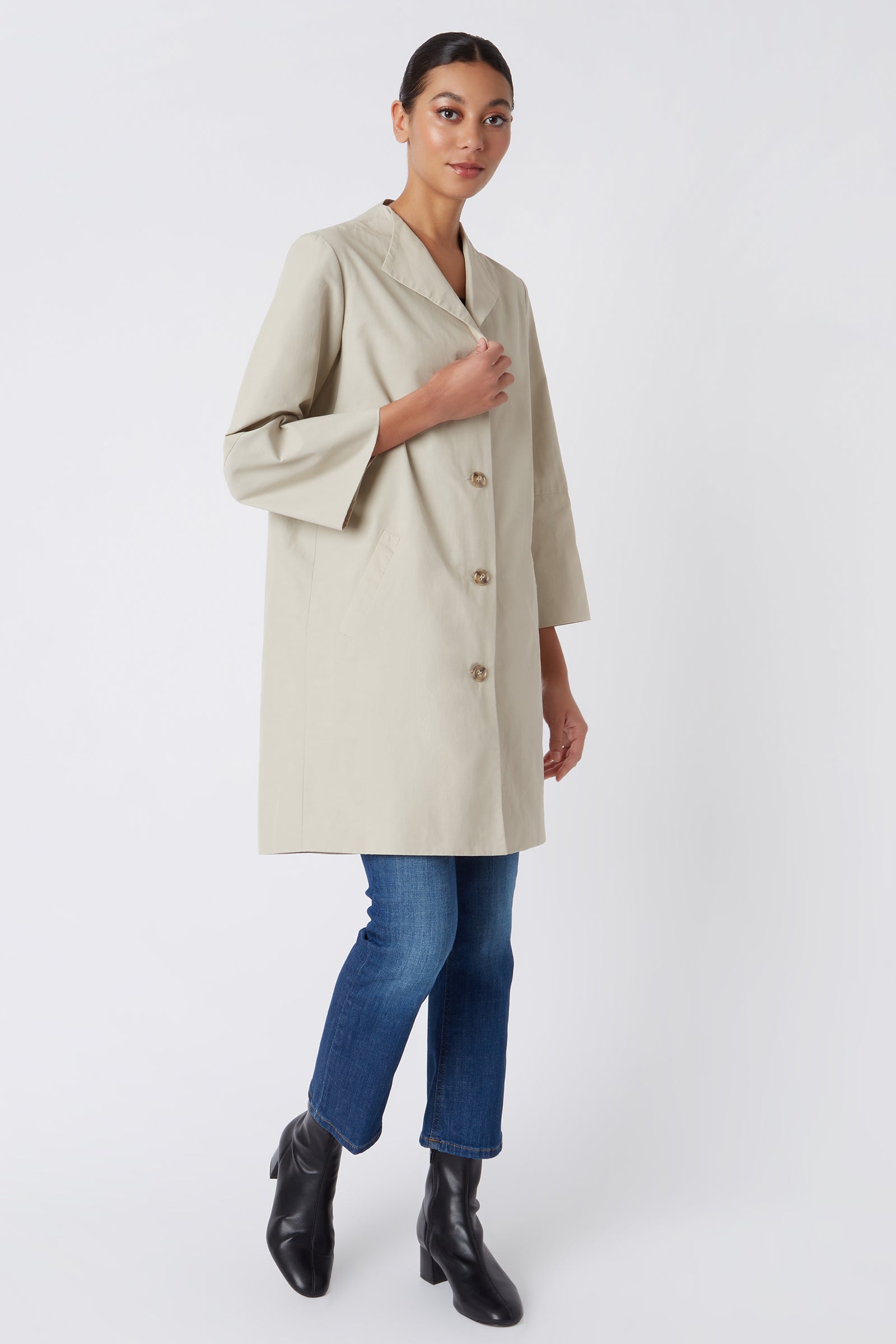 Kal Rieman Else Peacoat in Classic Khaki on Model with Hand on Coat Full Front View