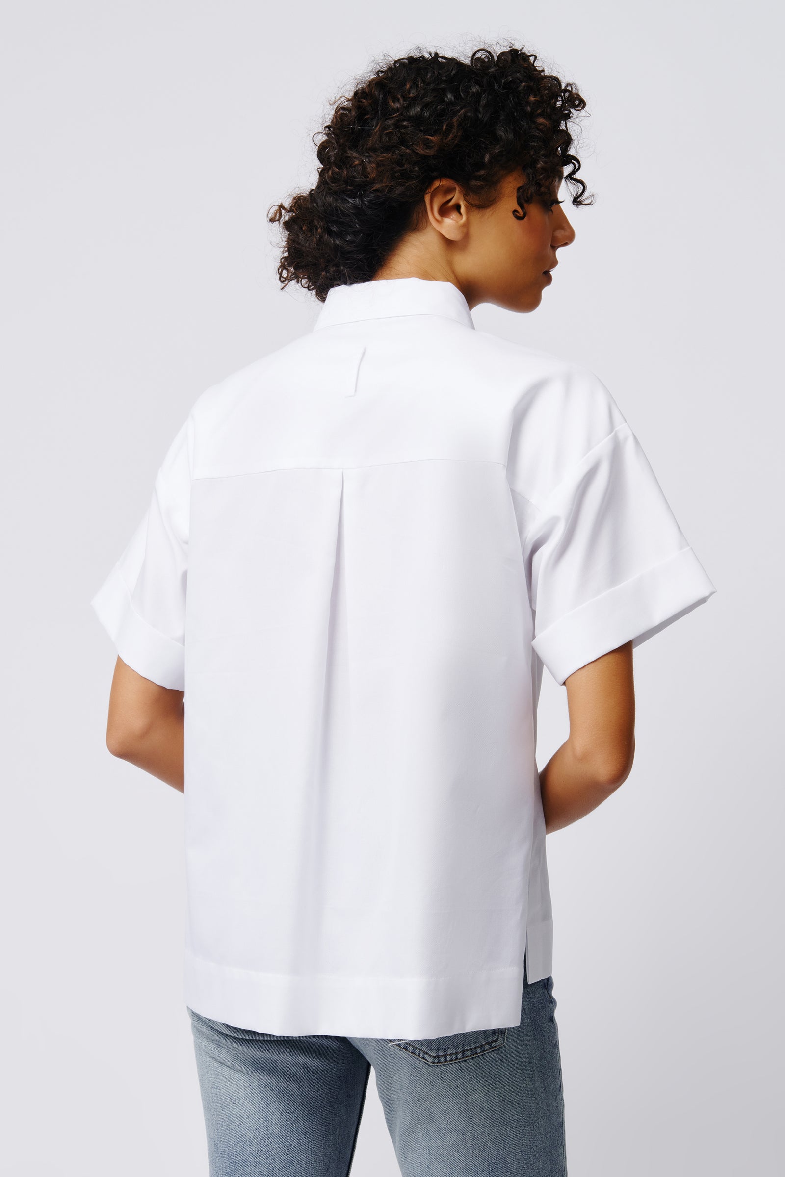Kal Rieman Billie Cuffed Short Sleeve Shirt in White on Model Front View Crop 2