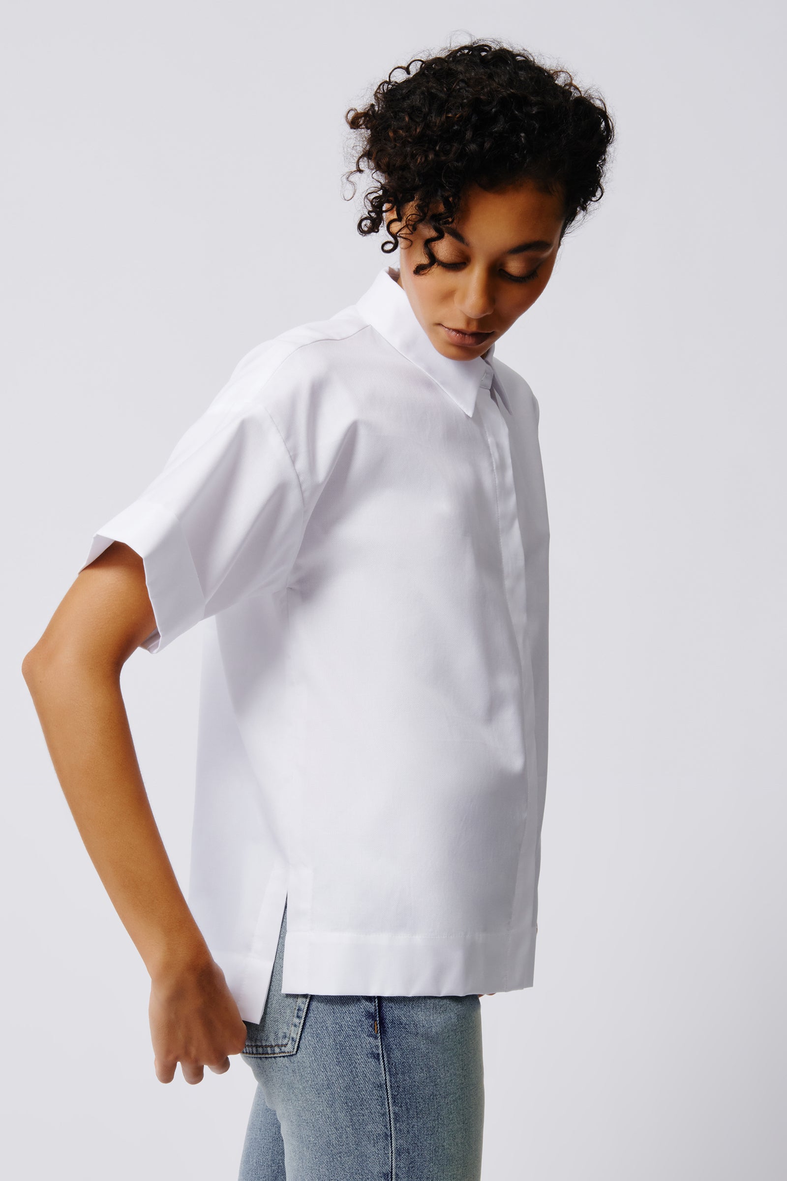 Kal Rieman Billie Cuffed Short Sleeve Shirt in White on Model Side View Crop