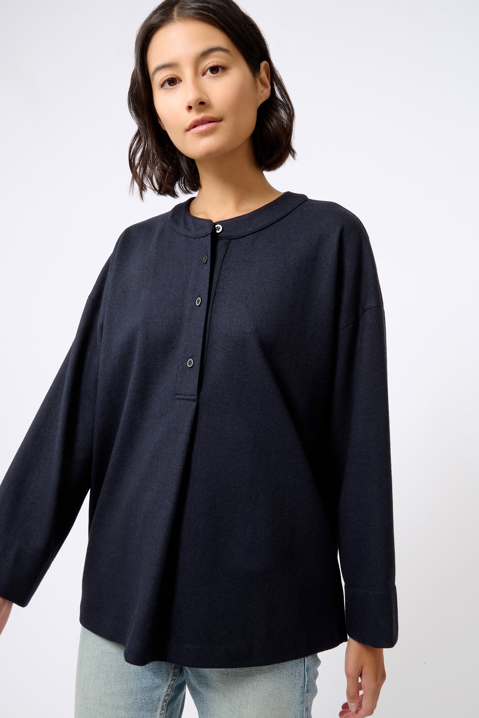 Kal Rieman Band Collar Top in Midnight on Model with Right Arm Out Front View