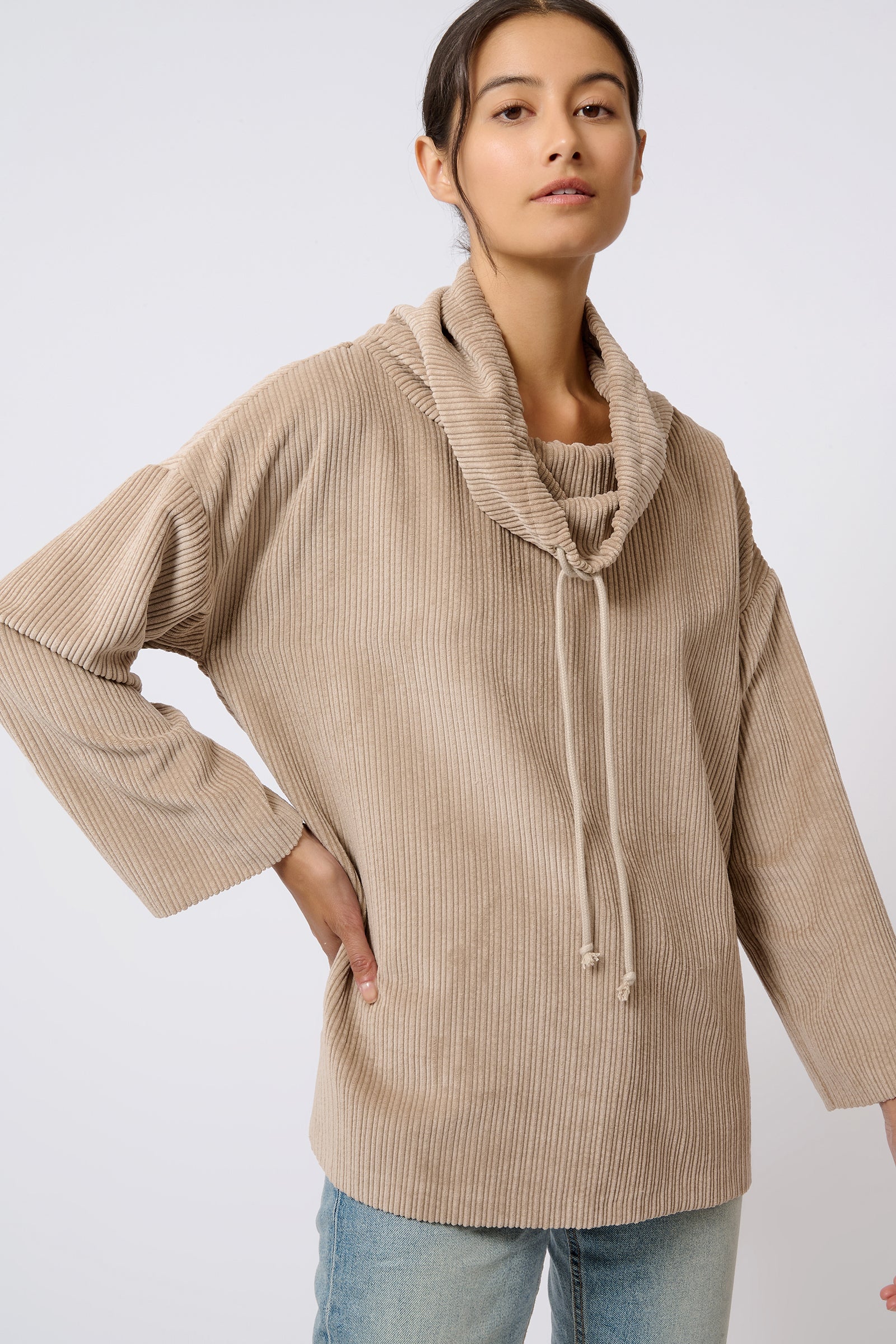 Kal Rieman Debbie Drawstring Pullover in Beige on Model with Hand on Hip Front View