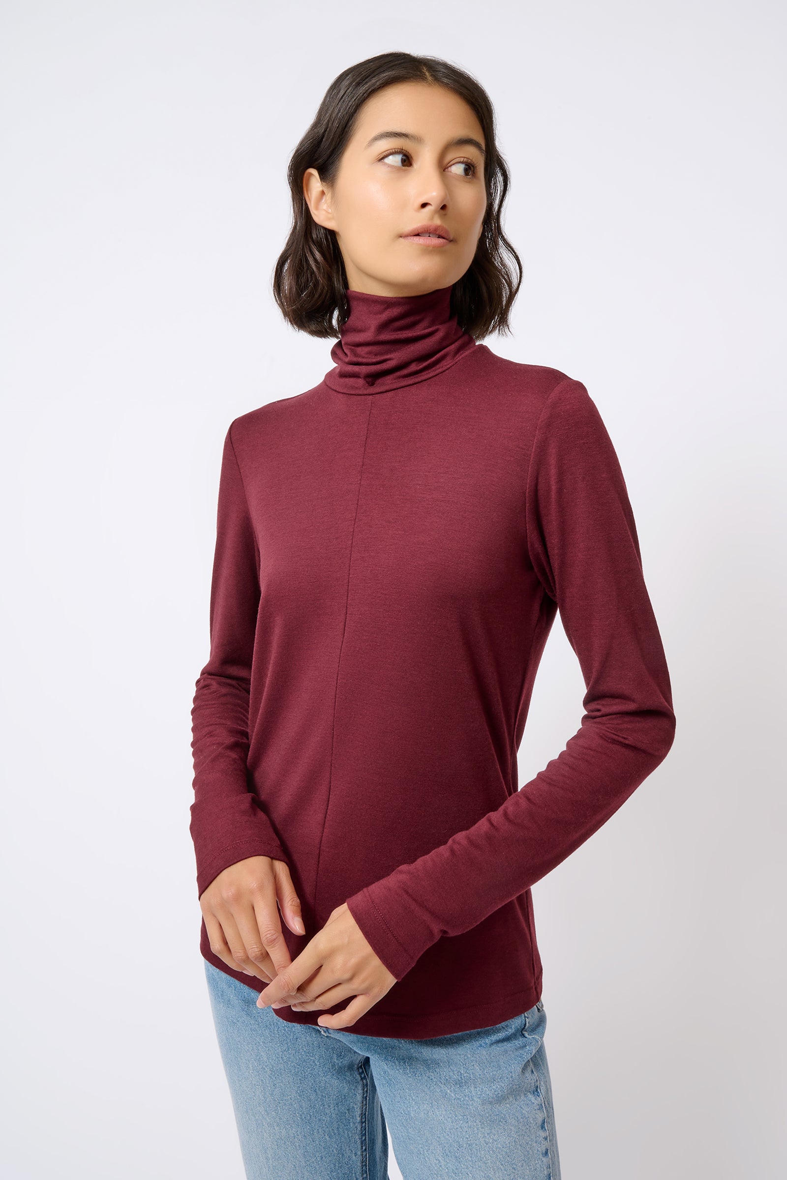 Kal Rieman Seamed Fitted Turtleneck in Wine Color on Model Looking to the Side