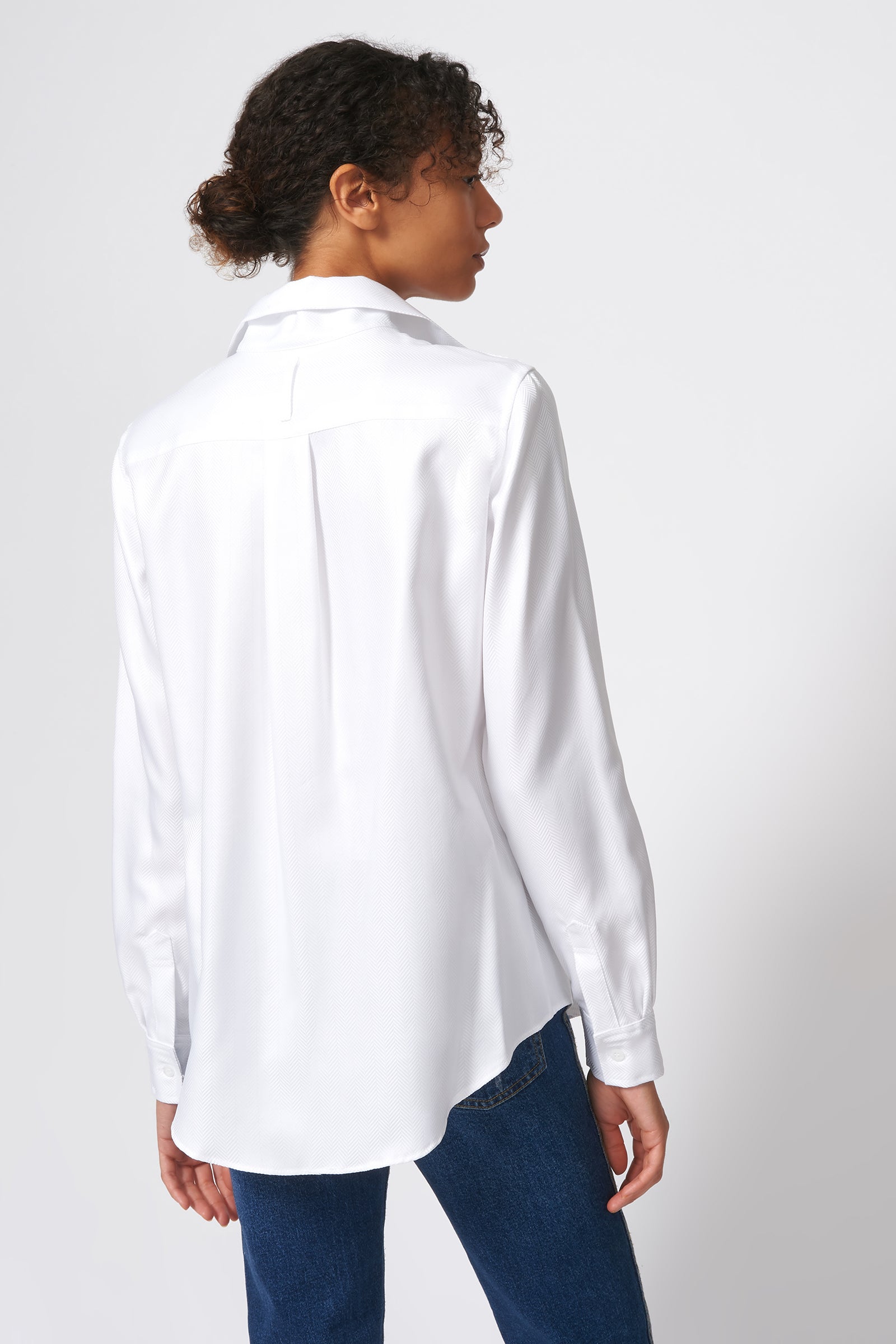 Kal Rieman Ginna Box Pleat Shirt in White Herringbone on Model front view holding collar