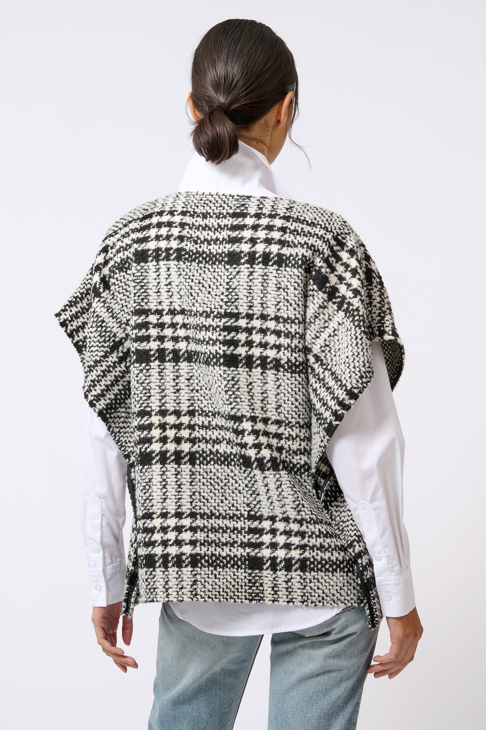Kal Rieman Plaid Poncho in Black and White Plaid on Model with Hands in Front Front View