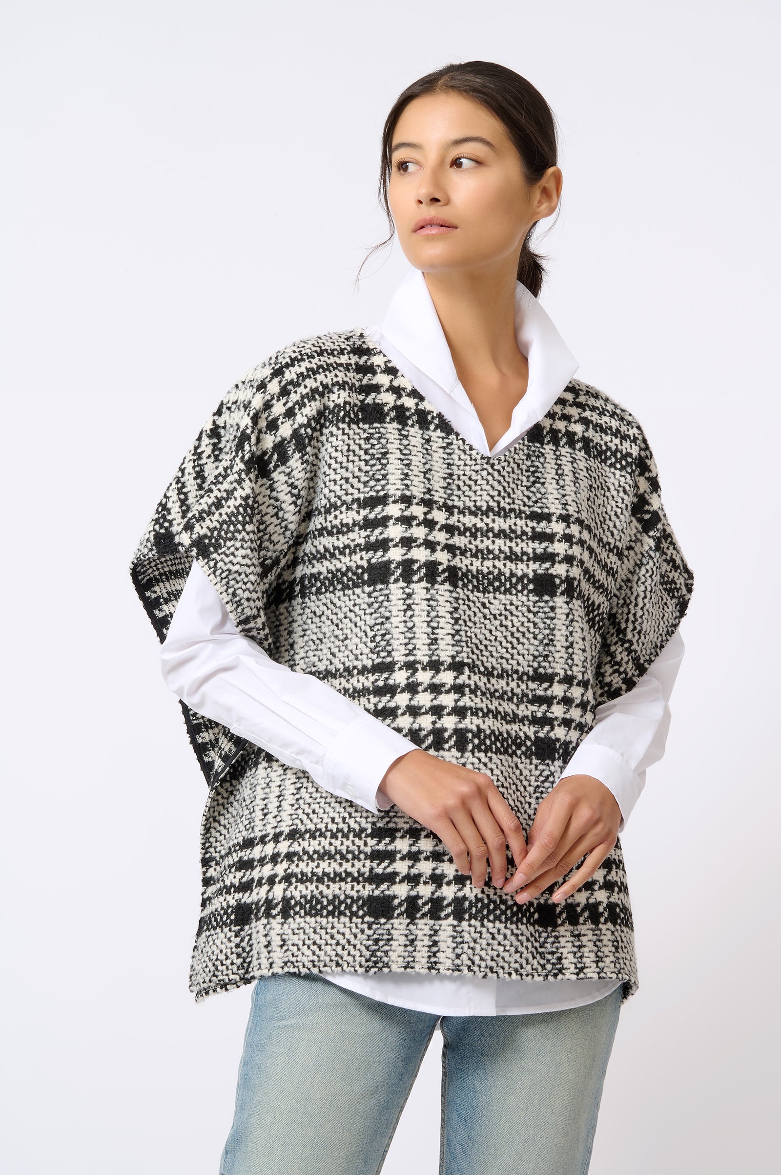 Kal Rieman Plaid Poncho in Black and White Plaid on Model with Hands in Front Front View