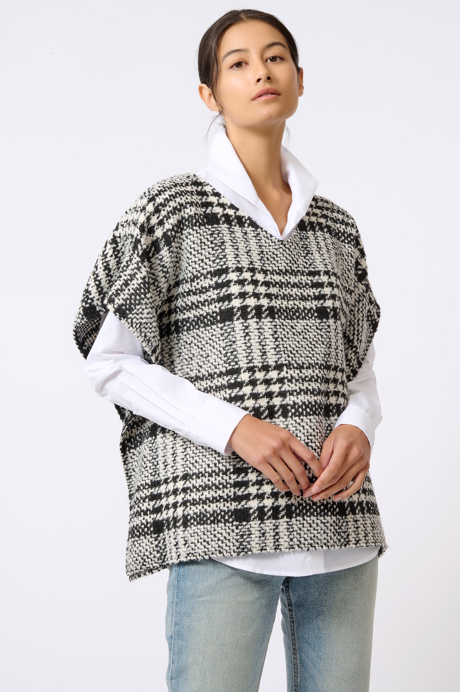 Kal Rieman Plaid Poncho in Black and White Plaid on Model with Hands in Front Front Side View